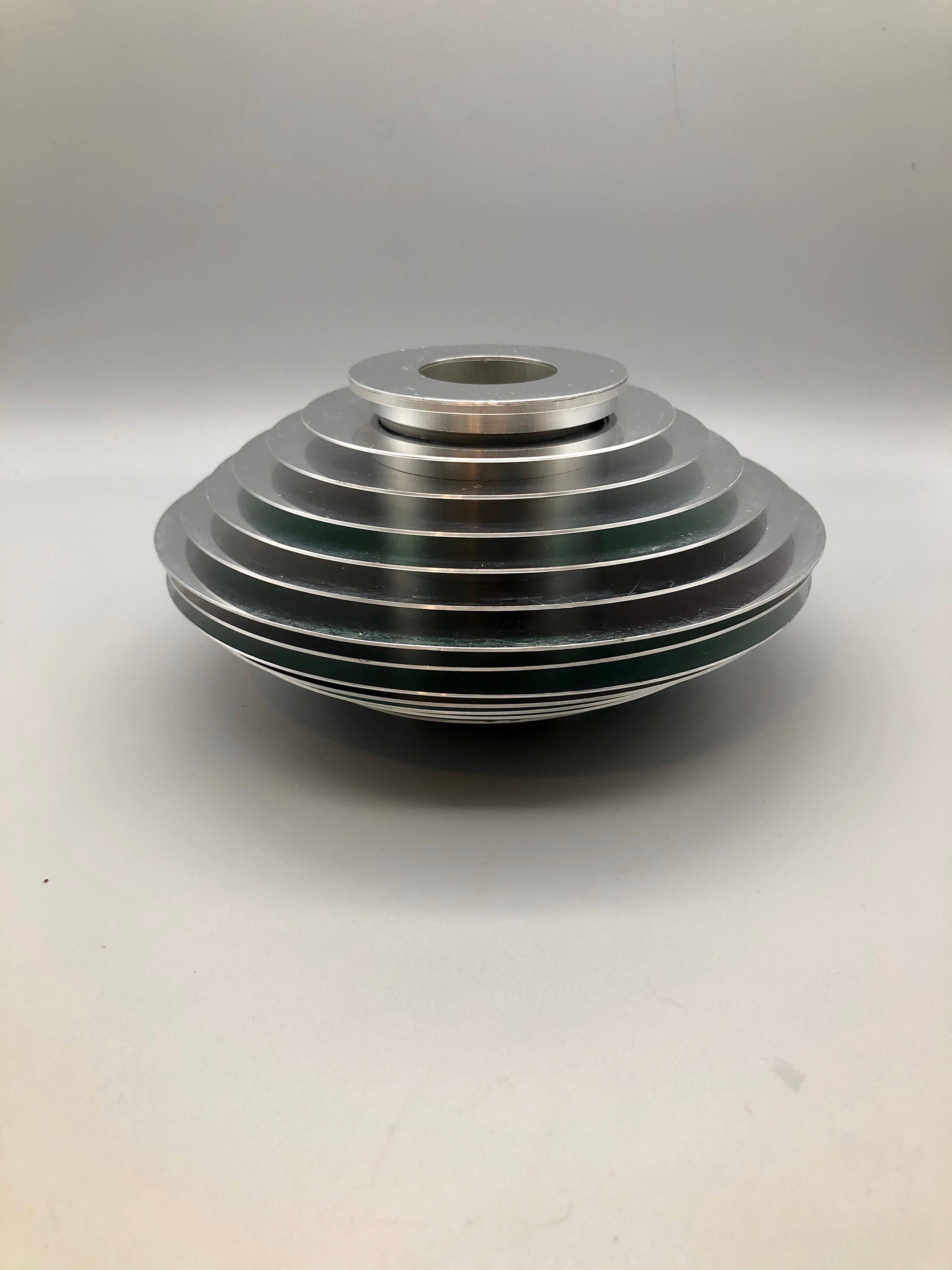 A rare pre-patent version of Avedis's infamous interlocking vase. Comes entirely apart into separate pieces and can be rearranged at whim. Can be used as candle holder or vase.

“After 30 years as a respected and eminent photographer, Avedis found