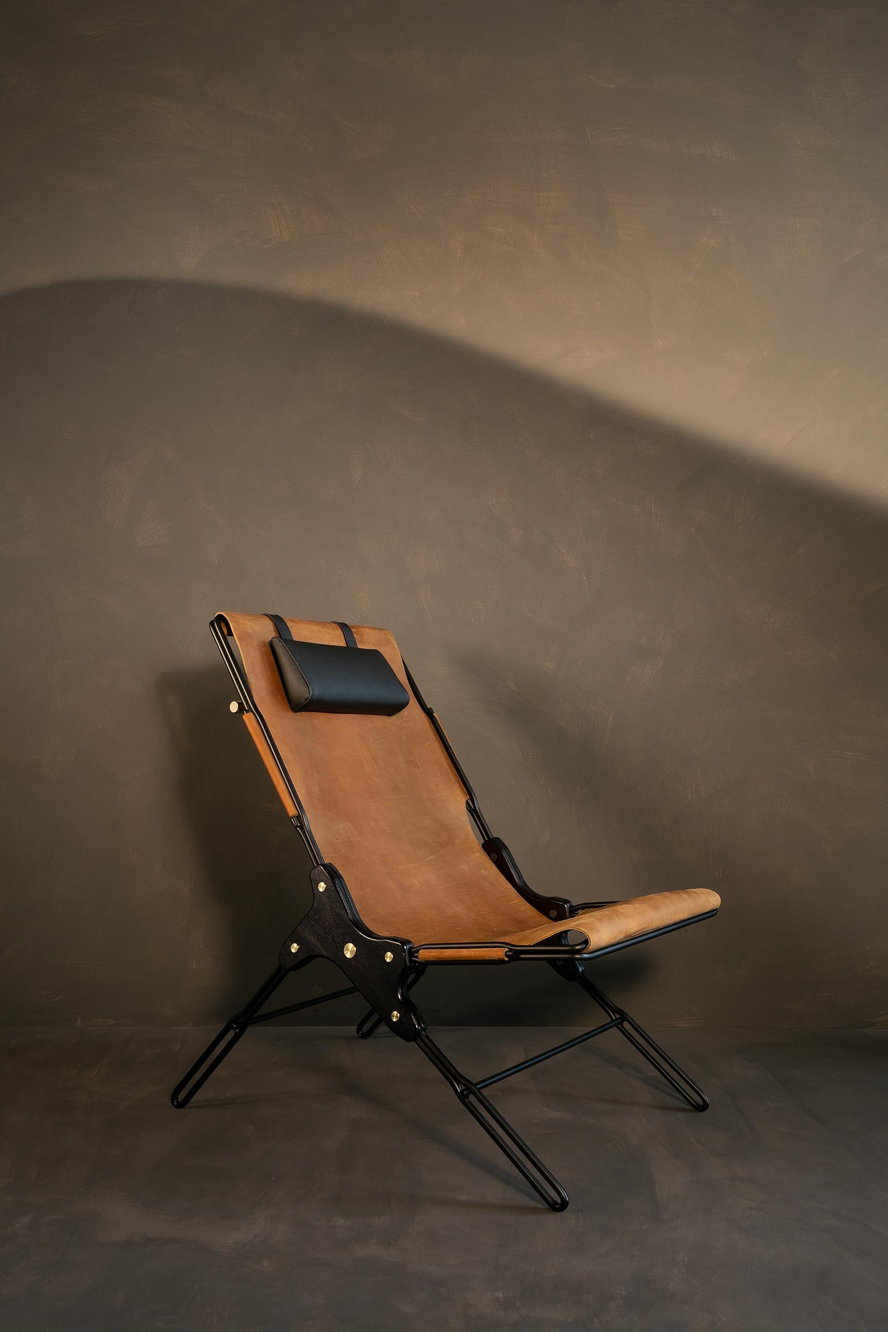 Avellana lounge chair by Estudio Andean 
Dimensions: W 56 x D 83 x H 93 cm
Materials: steel, bronze, wood, leather.

Lounge chair made of steel rod structure and solid colorado wood with a natural oil finish, Ecuadorian sustainable cowhide