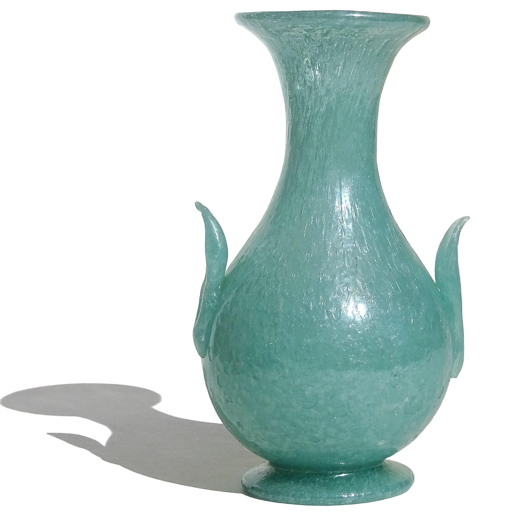 Beautiful antique Murano hand blown soft teal green Italian art glass flower vase, with applied handles decoration and flared foot. Documented to the Arte Vetraria Muranese company (A.Ve.M.). Published, photo illustrated in the company book, model