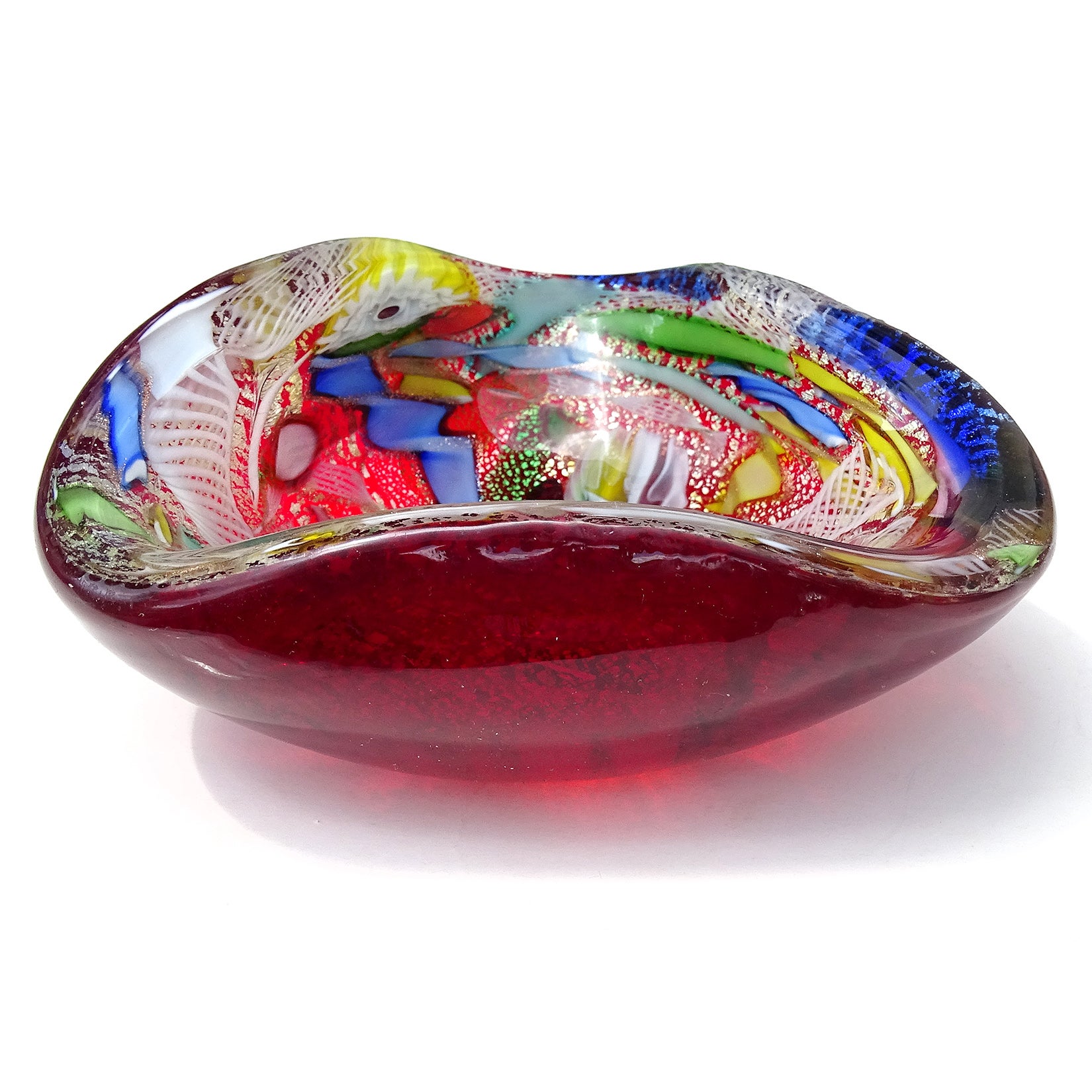 Beautiful vintage Murano hand blown red, silver flecks, millefiori flower murrines and twisted ribbons Italian art glass bowl. Documented to the A.Ve.M. (Arte Vetraria Muranese) company. The pattern / technique is published in the company book. The