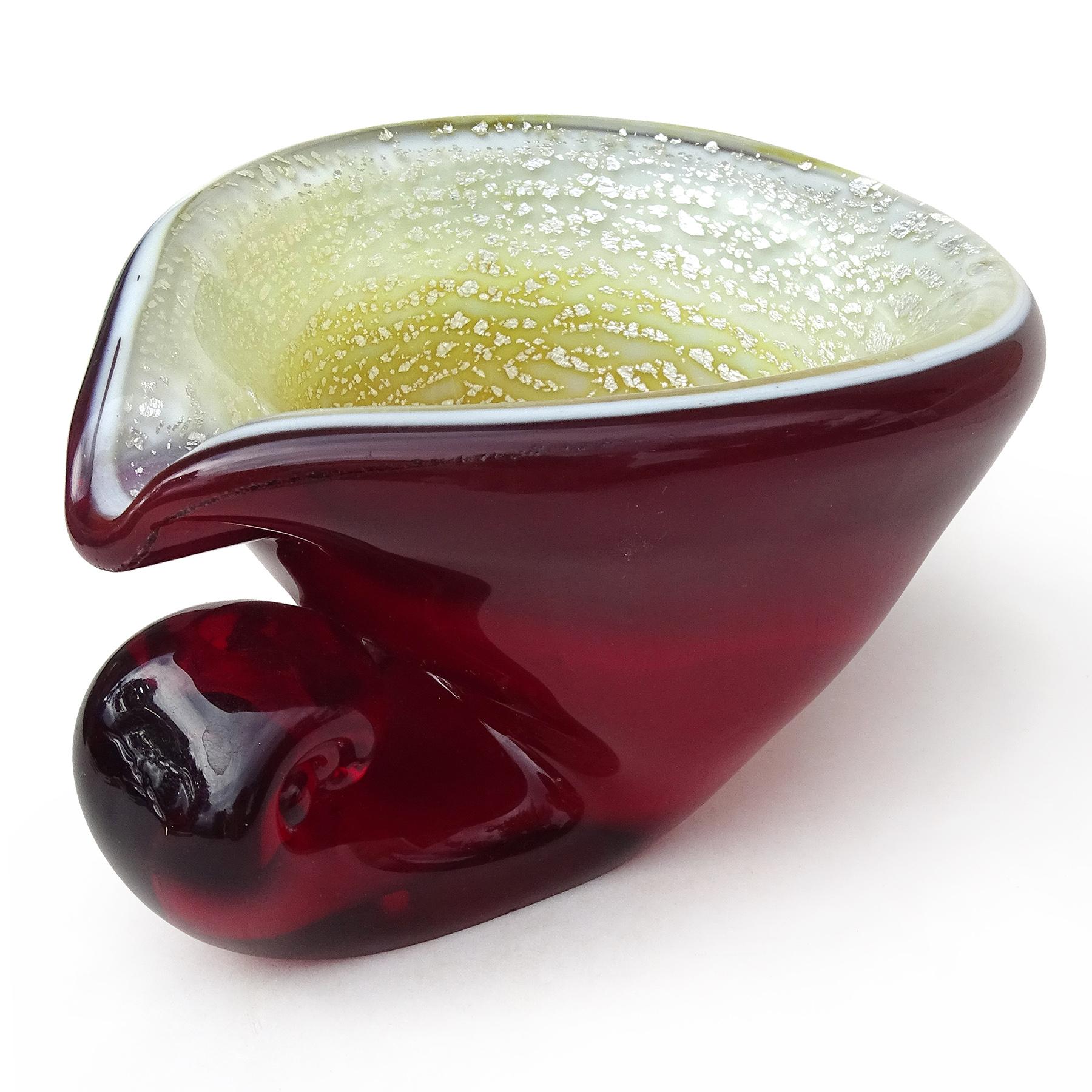 Beautiful vintage Murano hand blown red, silver flecks Italian art glass seashell shaped sculptural ashtray / trinket bowl. Documented to the A.Ve.M. (Arte Vetraria Muranese) company and attributed to designer Giulio Radi. The shell has a dark red