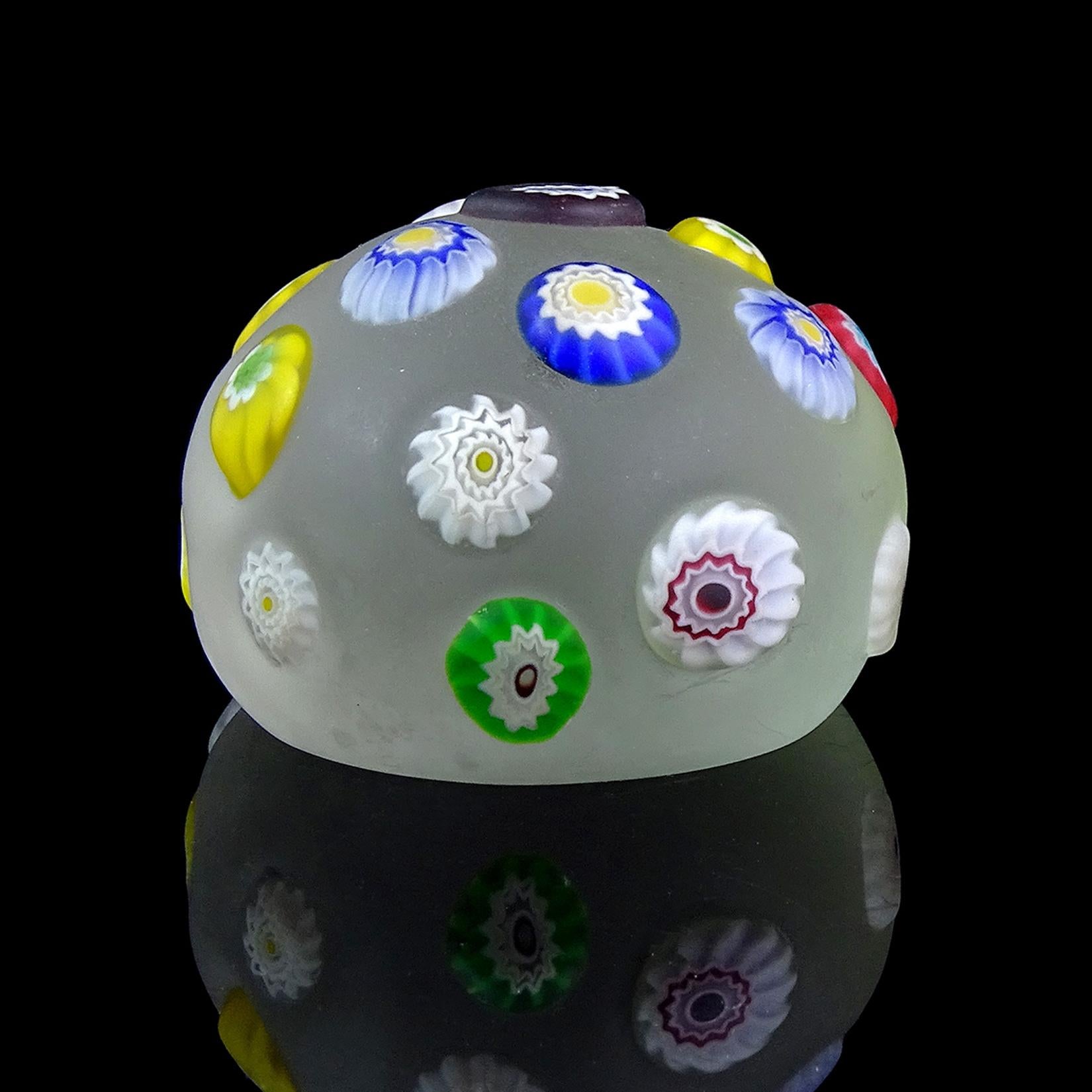 Last one available! 
Beautiful vintage Murano hand blown, satin surface and applied flower murrines Italian art glass paperweights. Documented to the A.Ve.M. (Arte Vetraria Muranese) company. The paperweight has different color cut flower canes,