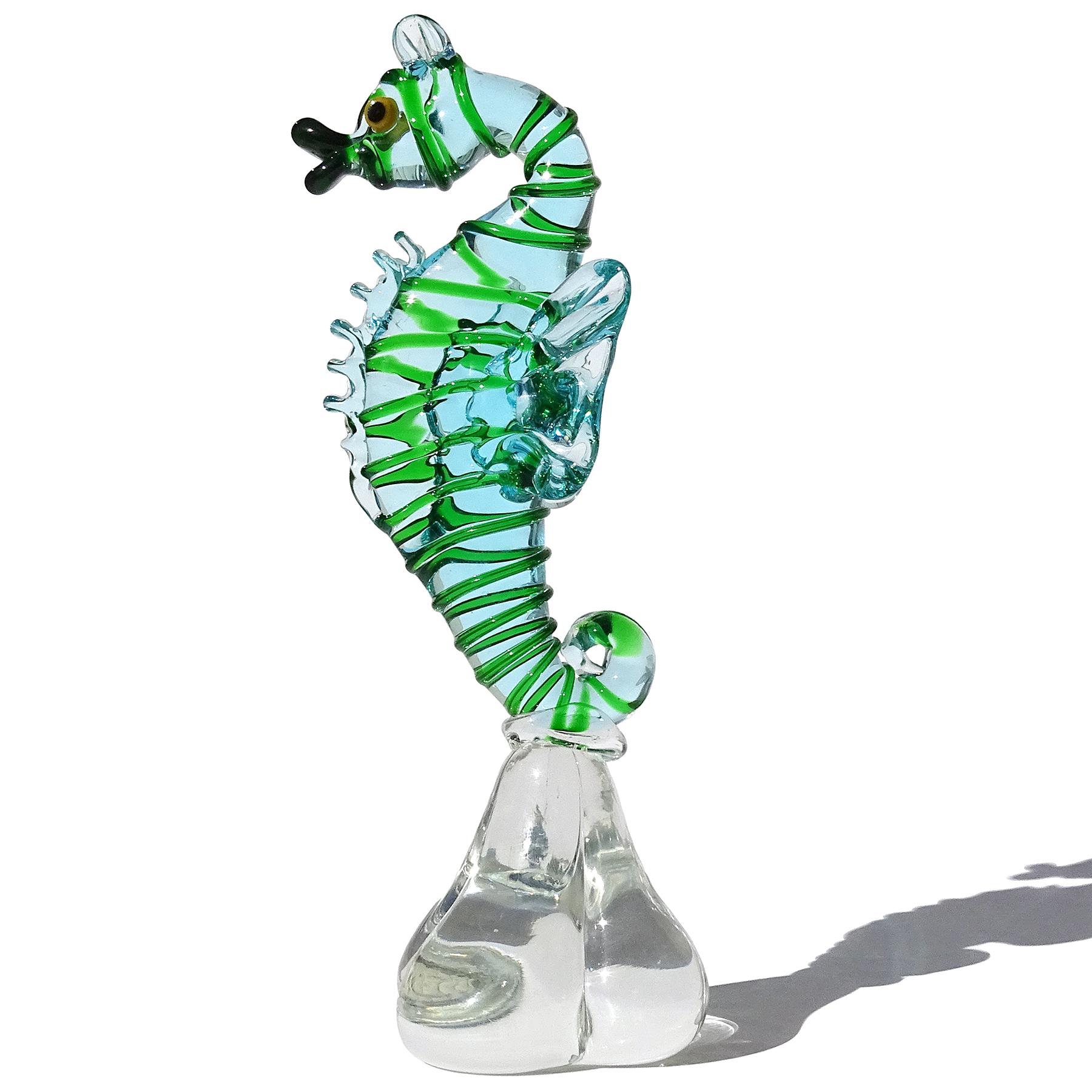 Beautiful vintage Murano hand blown light blue and green Italian art glass seahorse figure, sculpture. Attributed to the Arte Vetreria Muranese (A.Ve.M.) Company. The figurine is very well detailed, with a pouty mouth, applied yellow and black eyes,