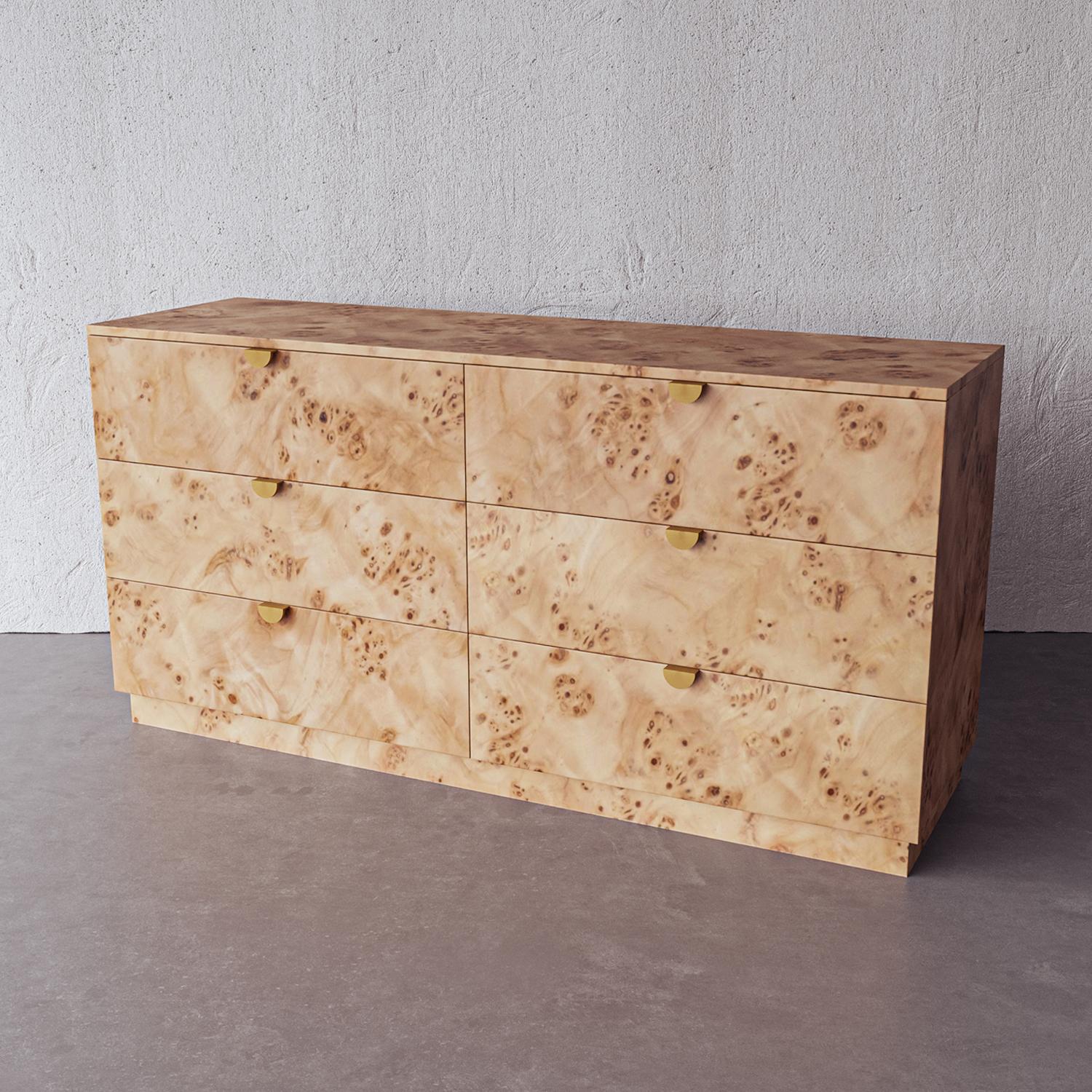 Simple, perfectly proportioned dresser in natural Mappa burl wood features artisanal hand-cast brass hardware and 6 drawers of storage for clothing and other household items. Handmade by artisans in Vietnam, this piece is a gorgeous addition to a