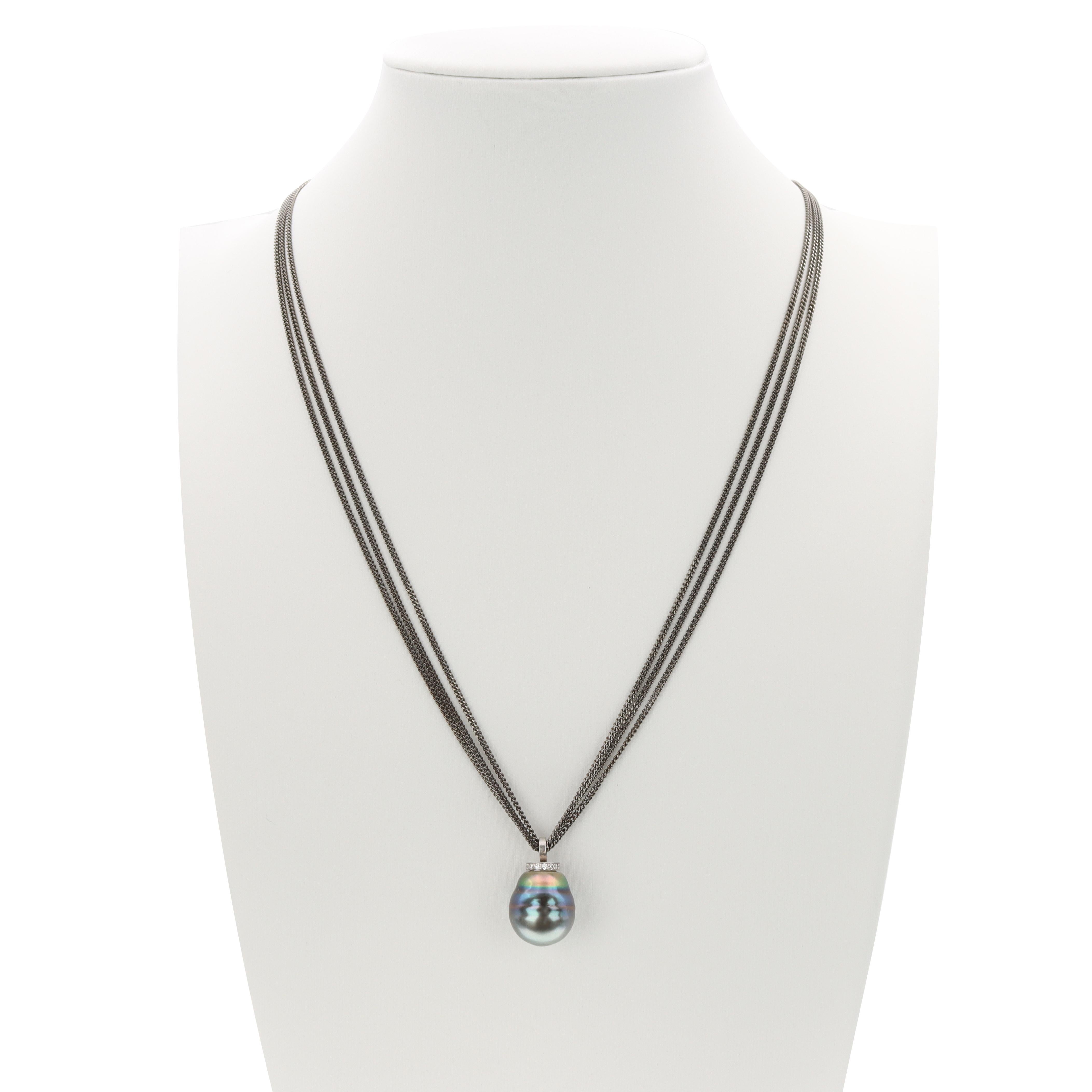 Created by Aventina-Spencer, this one-of-a-kind pendant features a 12mm Marc'Harit Conscious Circled Tahitian Pearl enhanced by 0.12 carats of round brilliant cut diamonds (G/VS), expertly set in recycled 18K white Gold. The pendant is presented on