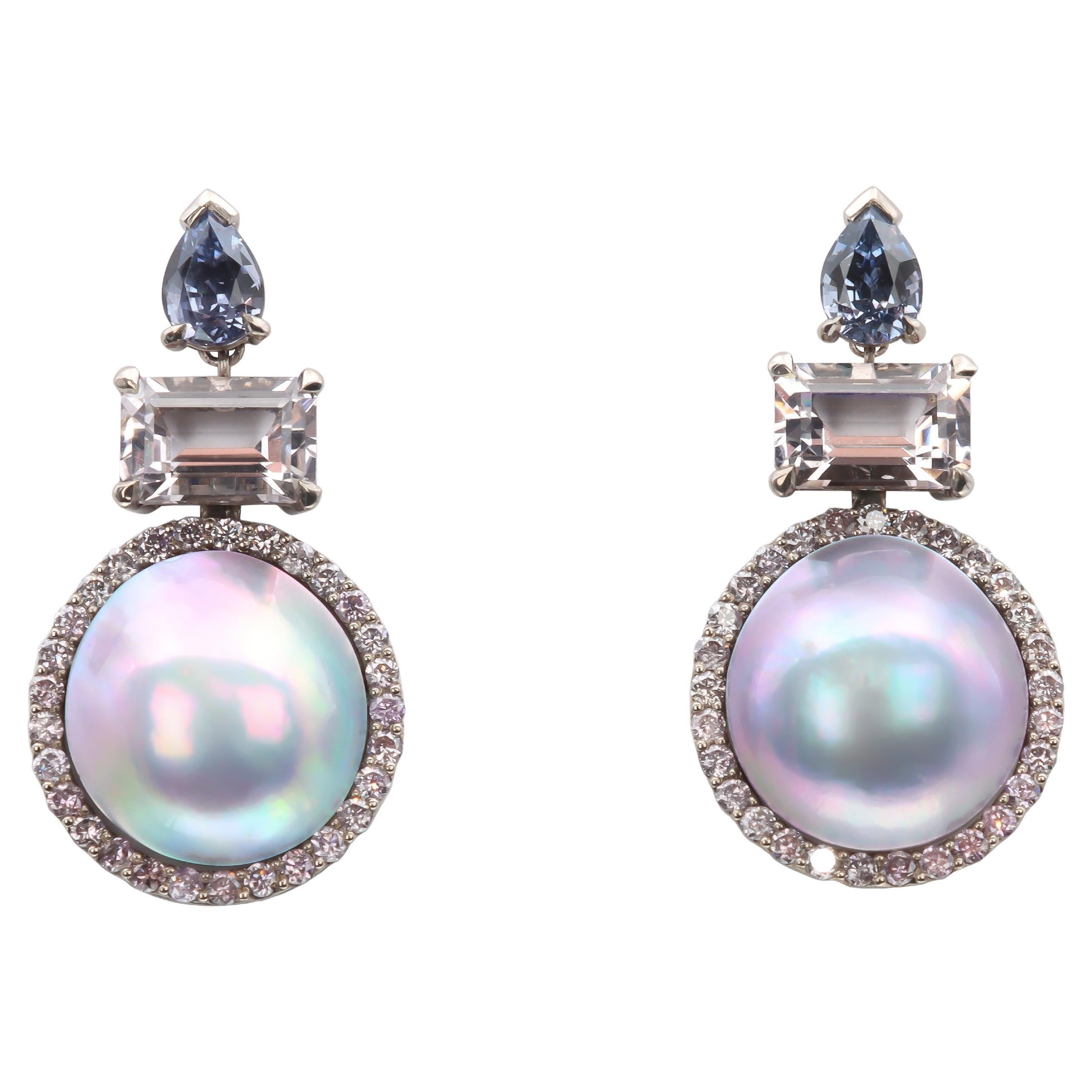 These one-of-a-kind earrings by Aventina-Spencer featuring Ultra Rare 13mm Cortez Mabé Pearls, 58 Round Brilliant cut Natural Fancy Colour Lilac Diamonds with VS clarity and a total weight of 0.88 carats, Madagascan Pear shaped Lilac Spinels