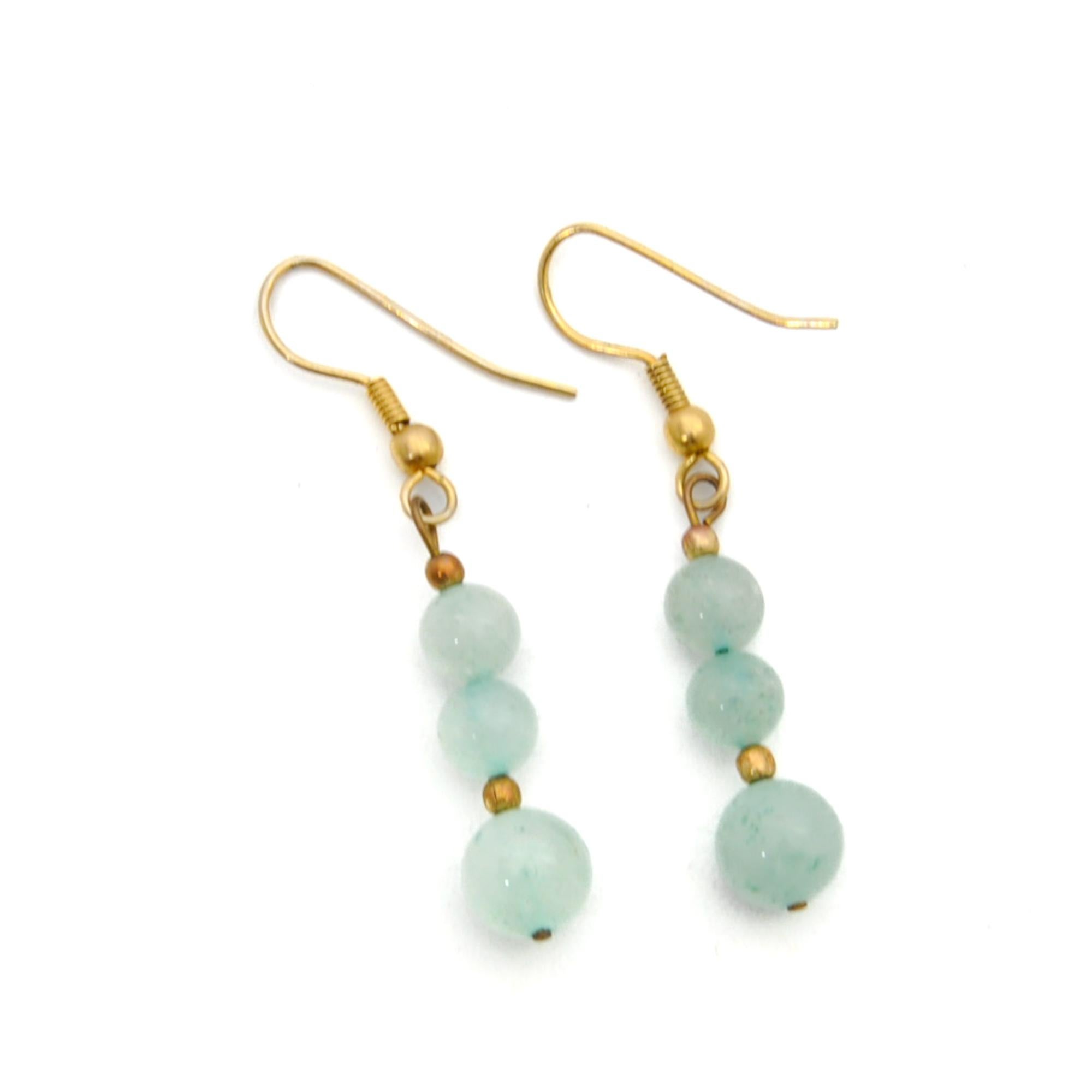 A beautiful pair of polished natural green silky glow aventurine bead earrings. Aventurine is an eye-catching crystal that is adored by many for its beautiful shiny appearance. The presence of the mineral fuchsite gives aventurine its unique green
