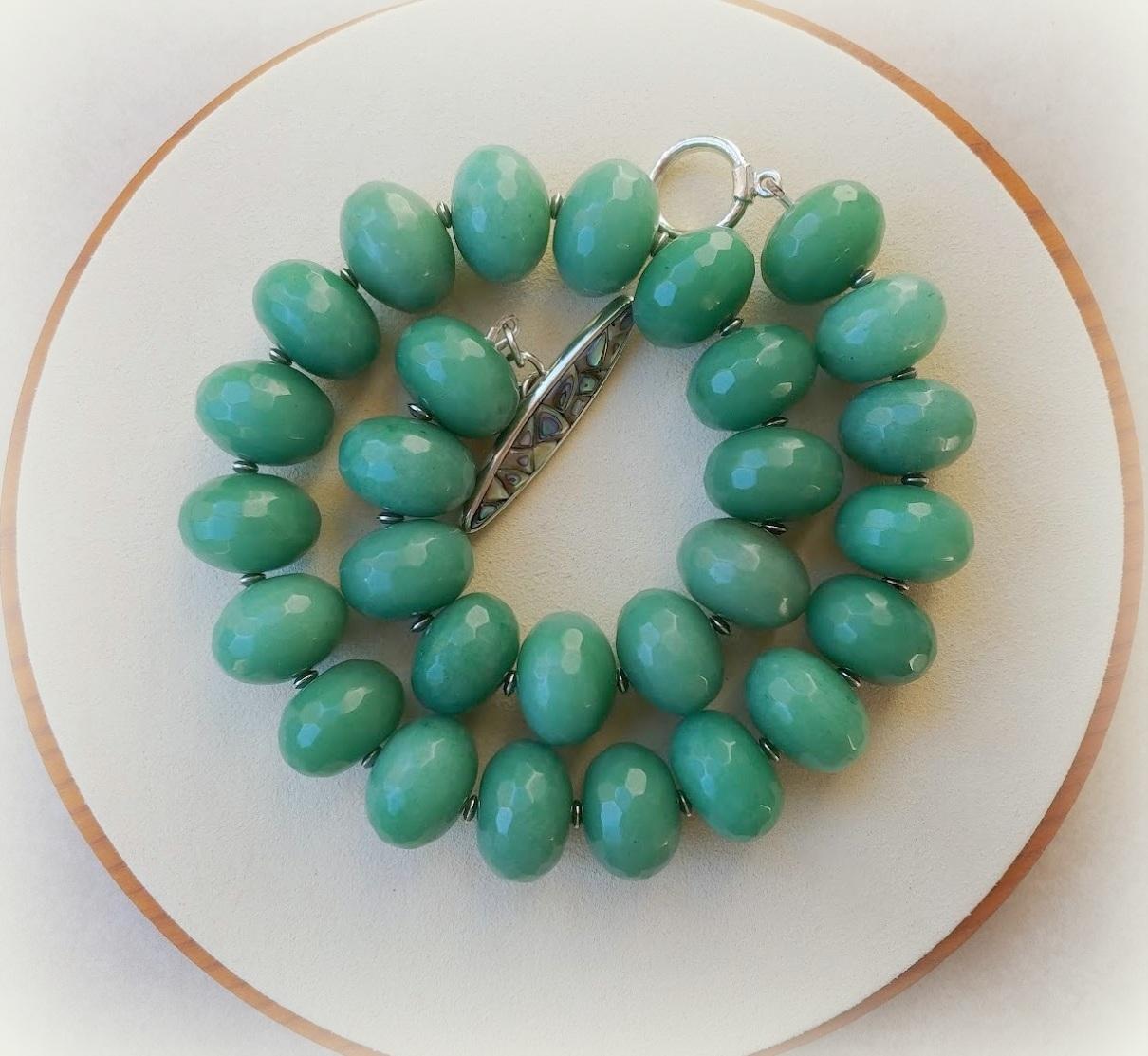 The necklace is 18.5 inches long (47 cm) and weighs 241.5 grams (8.5 oz).
The aventurine faceted rondelle beads are 20 mm in diameter, and the silver spacer beads are 4mm in diameter and tested as 925 sterling silver.
The necklace is fastened with a