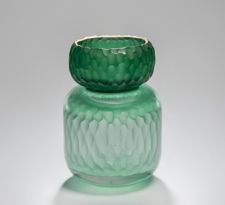 The Aventurine Geode Jar is a unique piece created from cast glass by the British artist Angela Jarman. Using the lost wax technique, it is cast from pale green and green lead crystal. The top insert is finished with a 22-carat gilt rim.

Jarman is