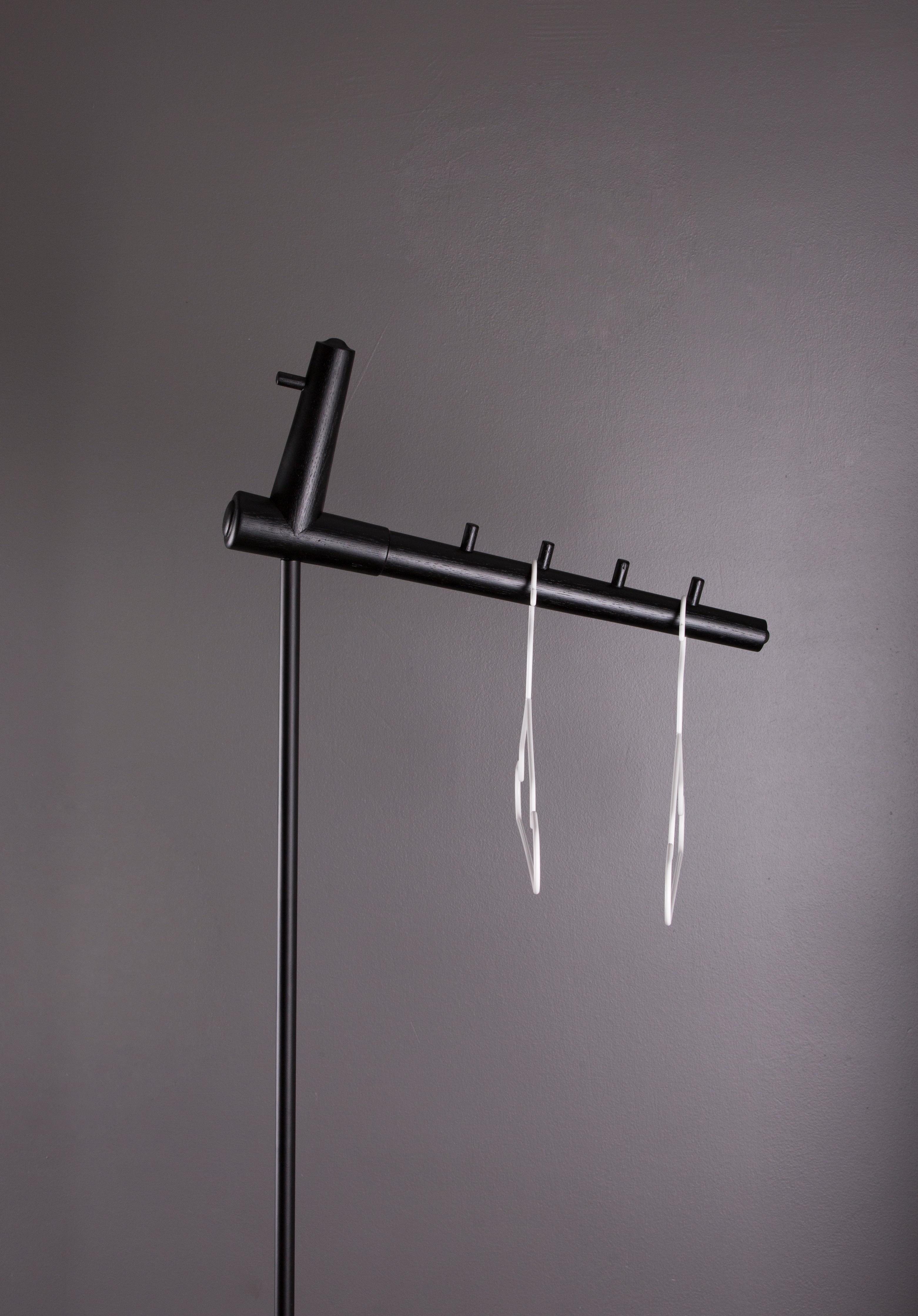 Aves hanger by Rectangle Studio
Dimensions: W 24 x D 48 x H 125 cm
Materials: Massive oak, black wood oil, black paint coating on metal

Aves provides practical solutions in constricted areas. When the cloth is hung, the Aves, which is the