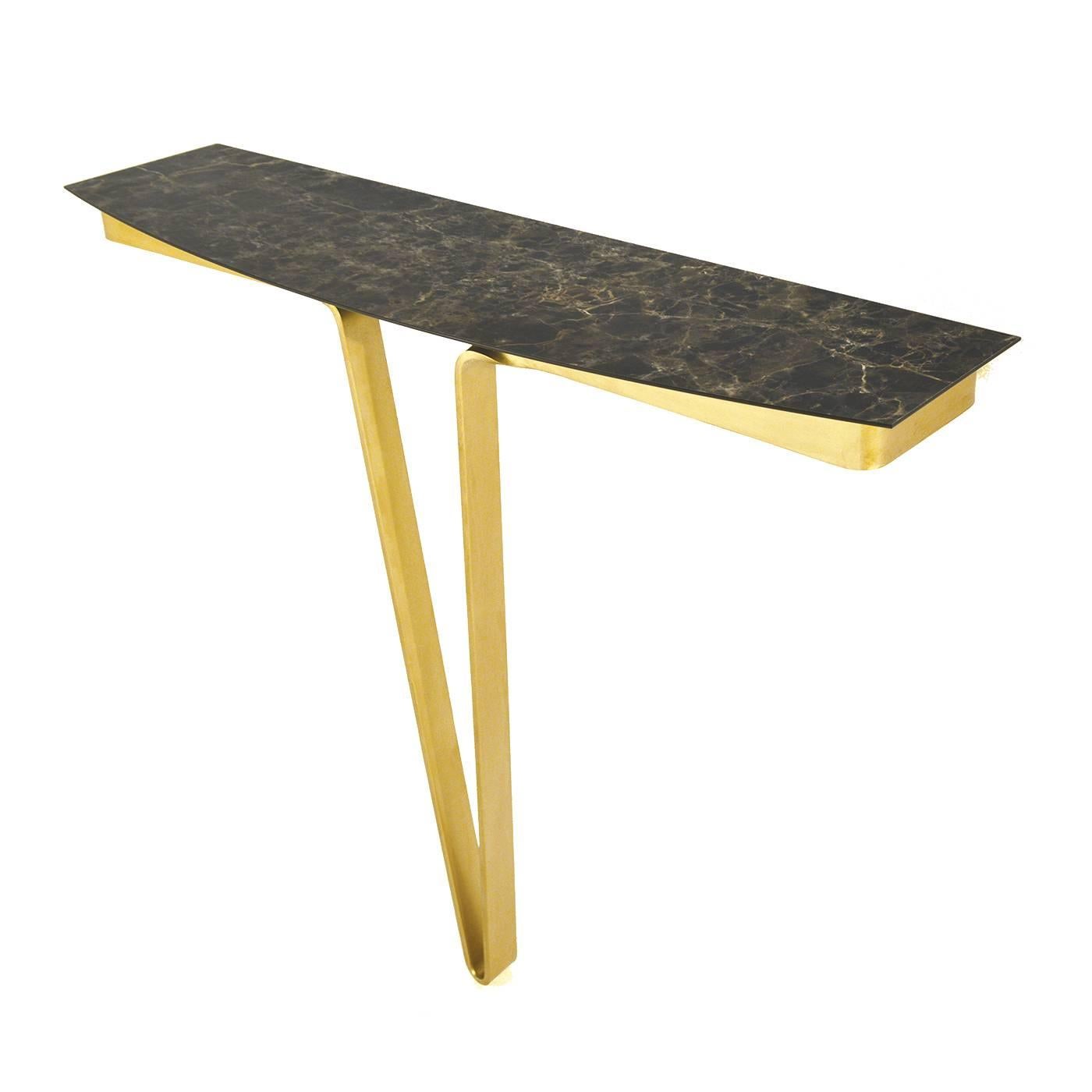 This minimalist console integrates modern design with functionality and originality. The base, a single V-shaped leg, is made of hand-forged iron blade with a striking burnished gold antique finish, while the rectangular top is of stratified HPL MOD