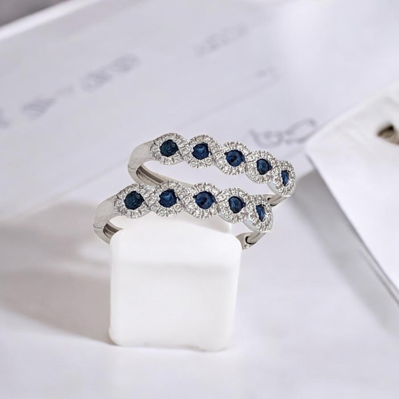 Dazzle from every angle with these exquisite 10k white gold hoop earrings, featuring a captivating blend of 0.45 carats of rich blue sapphires and 0.33 carats of sparkling natural diamonds. 💙💎

Crafted with a secure release lock hinge, these hoops