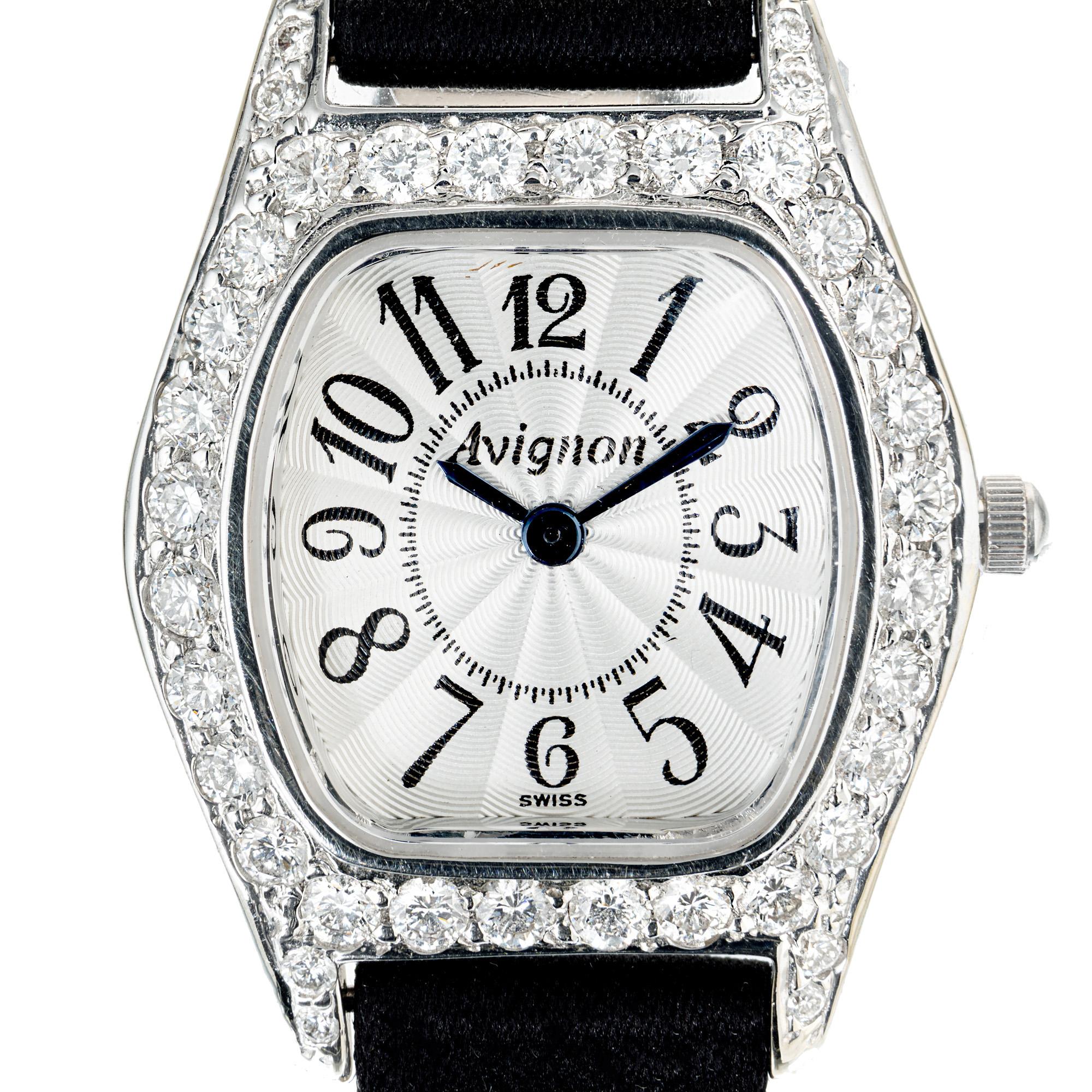 Ladies' Avignon 14k white gold watch. 40 round full cut diamond diamond bezel with a black satin strap.  

40 round full cut diamonds, 1.65ct, F color, VS clarity. 
14k White Gold
Tip: 32.68mm
Width without crown: 24mm
Width with crown: 26.34mm
Band