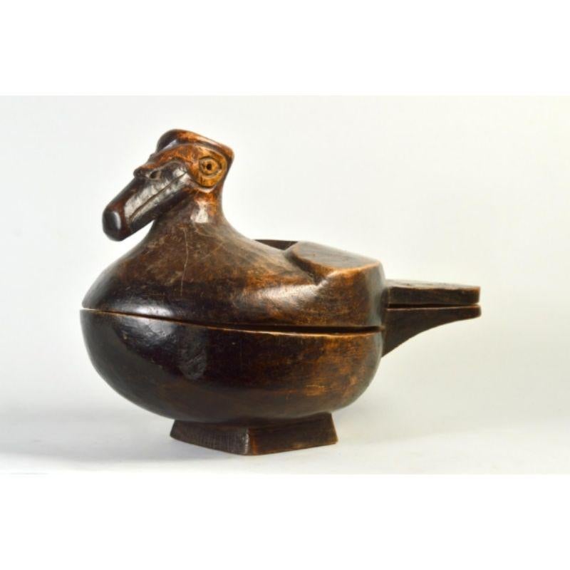 Avimorphic Lozi lidded container in wood.

This lidded container would have been used to contain food such as cornmeal, dried beans, biltong, and spices. The carving depicts the form of an Egyptian goose, a bird native to sub-Saharan Africa. The