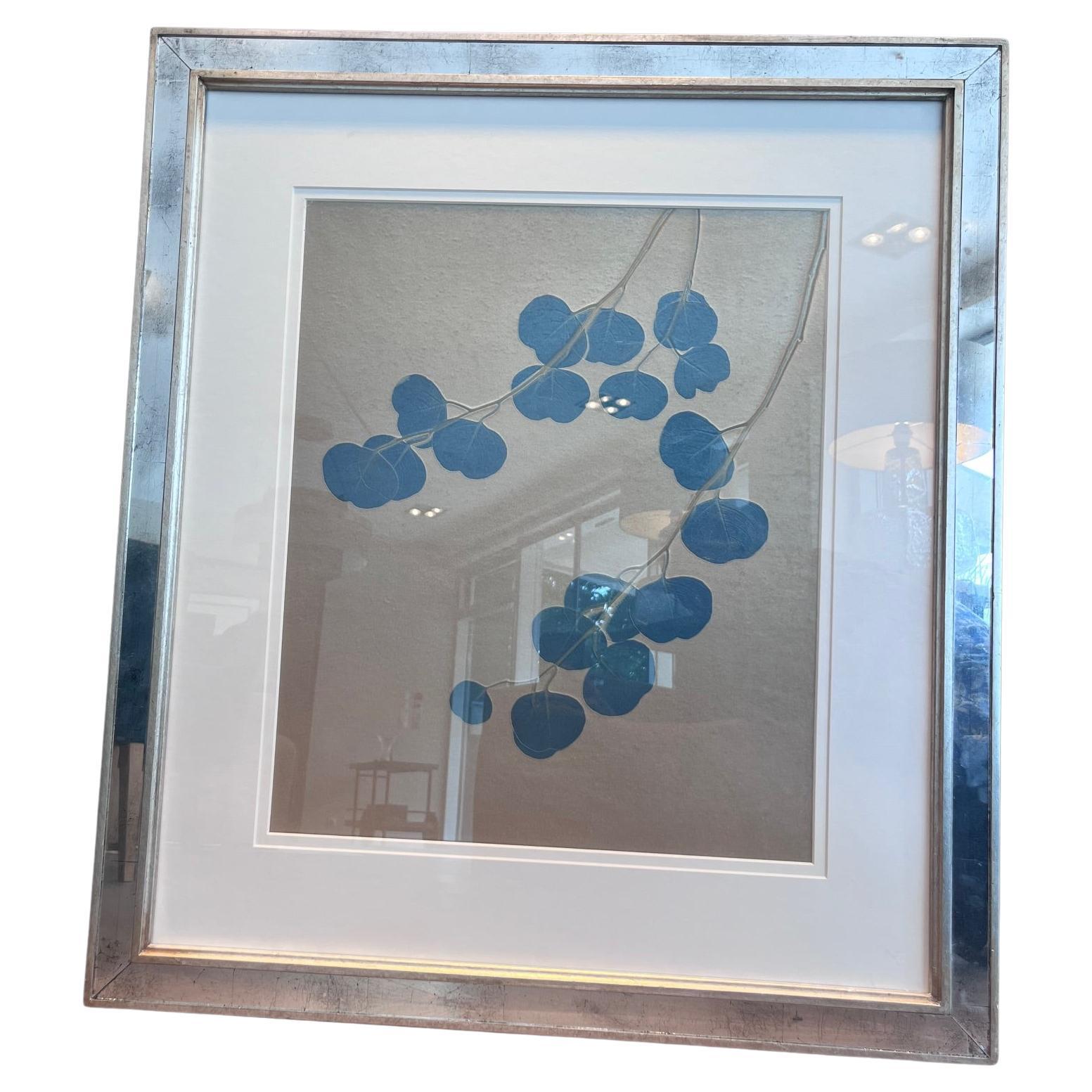 This elegant botanical artwork is part of the Aviva Textiles collection by Trowbridge Gallery. The stylized eucalyptus branch in muted blue tones is printed on a soft cream background, offering a calm and modern aesthetic.



It is beautifully