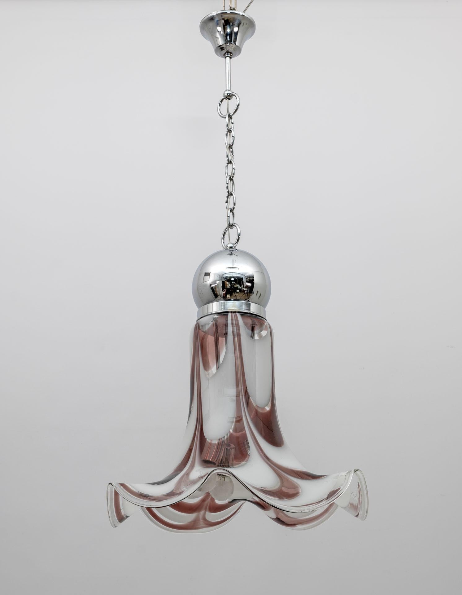 This ceiling chandelier is characterized by a bell-shaped lampshade in white and brick red Murano glass and chromed metal, produced by the AVMazzega glassworks in the 70s