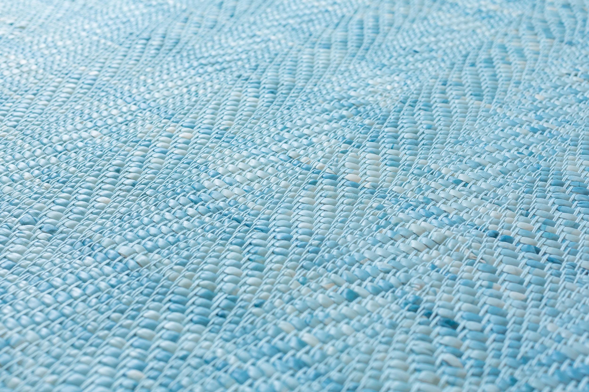 This 8' x 10' wave rug is hand dyed in our Brooklyn studio and woven with artisans in the United States. It is designed to have textural and visual depth with a cushioned feel and refined selvage edge. We use dyes, not paint, to create our work,