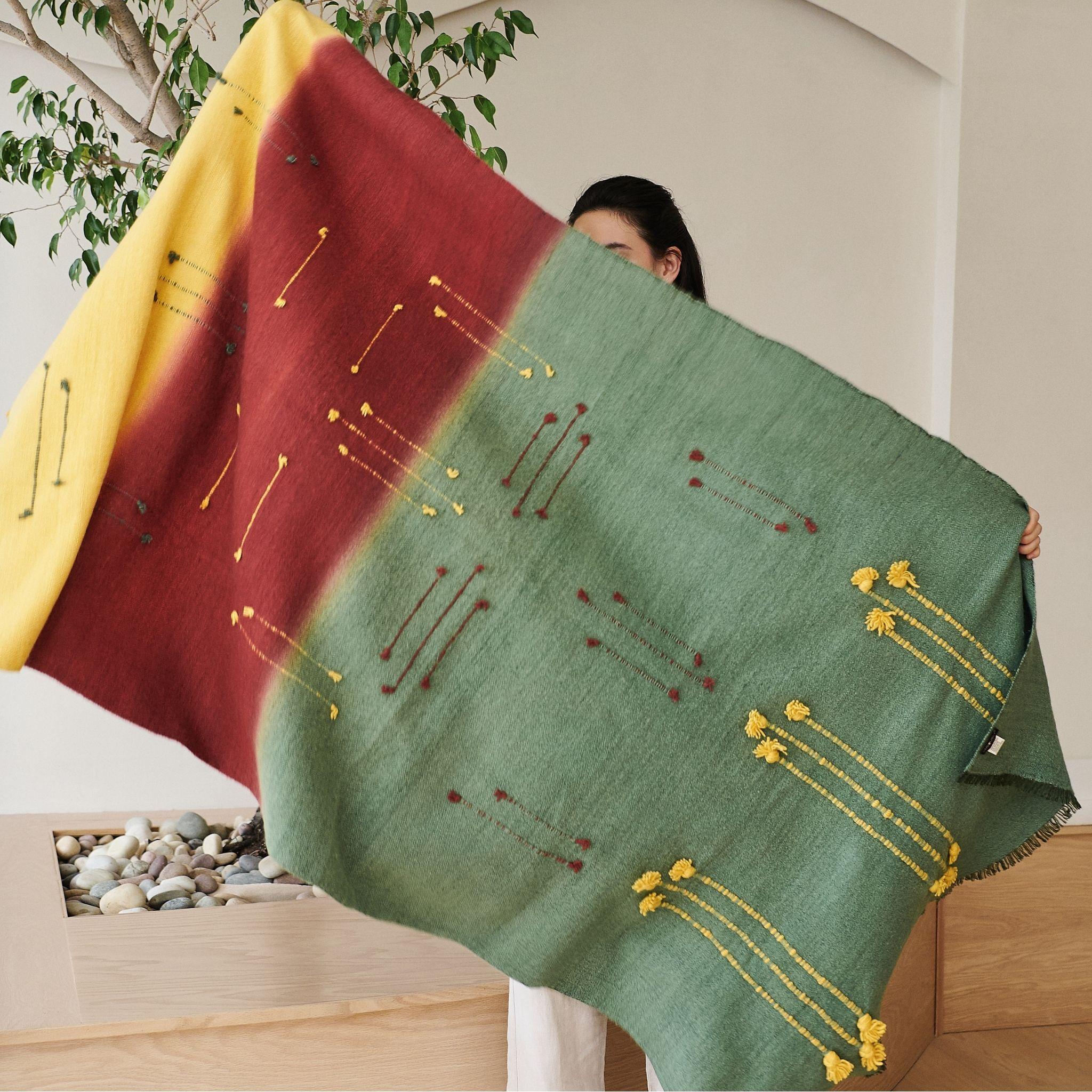 A quiet reflection of the walk in the woods with bold contrasting color choices and textural details all created meticulously by expert artisans is what Avacado Throw is all about. Modern harmony brought to life with locally sourced hand spun merino