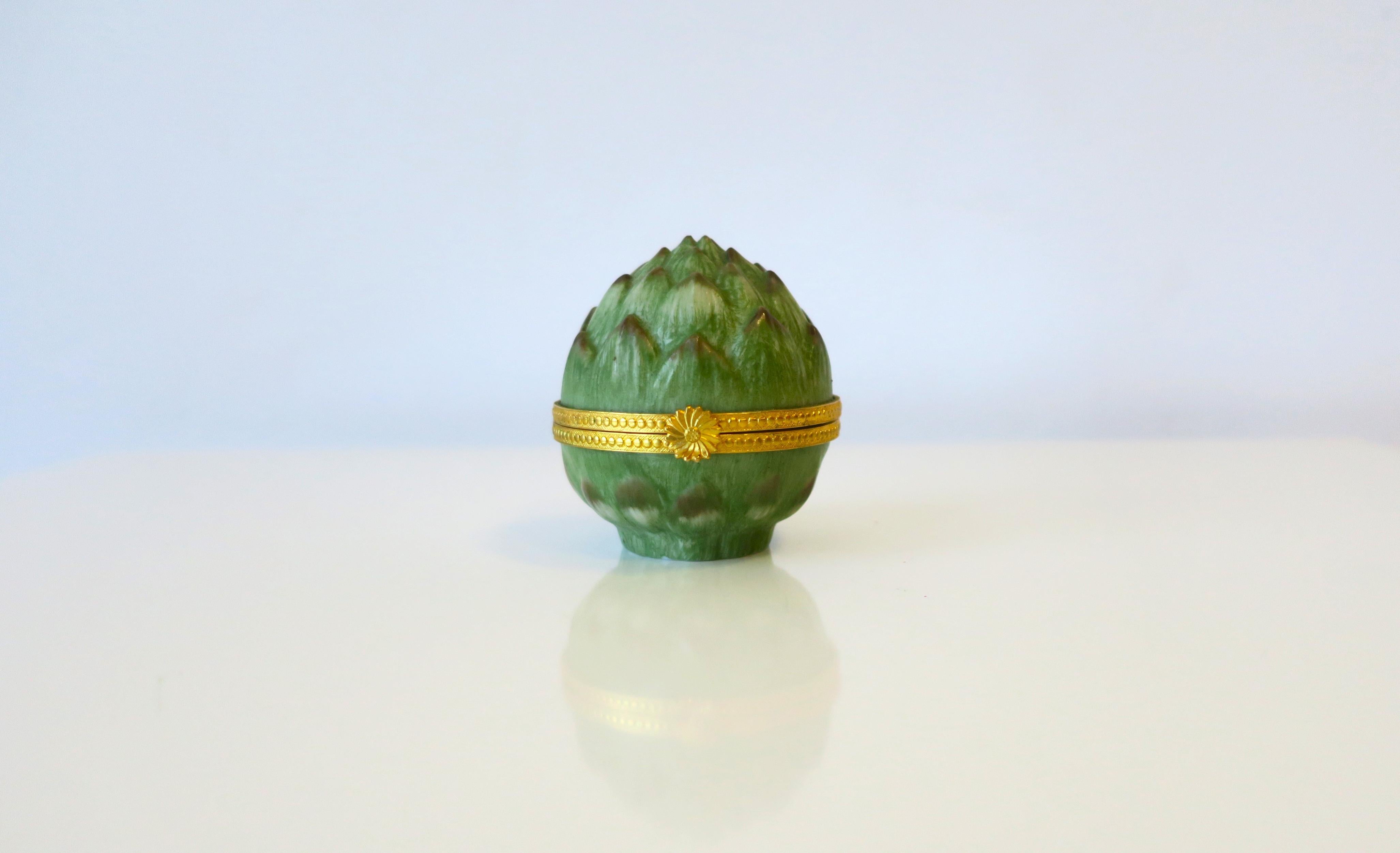 A beautiful, small, porcelain 'artichoke' box, circa mid to late-20th century, Europe, possibly, France (French porcelain box.) A fun green porcelain 'artichoke' fruit vegetable box with gold gilt brass hinge and floweret front lift. Box as and