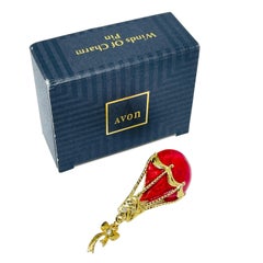 AVON gold tone red enamel rhinestone bow ballon  'WINDS OF CHARM' pin