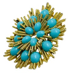 Broche de créateur AVON signée en or et fausse turquoise