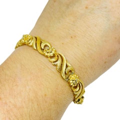 AVON pulsera de diseño vintage firmada en tono dorado