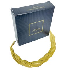 AVON vintage gold tone ''BRAIDED HERRINGBONE" chain designer bracelet