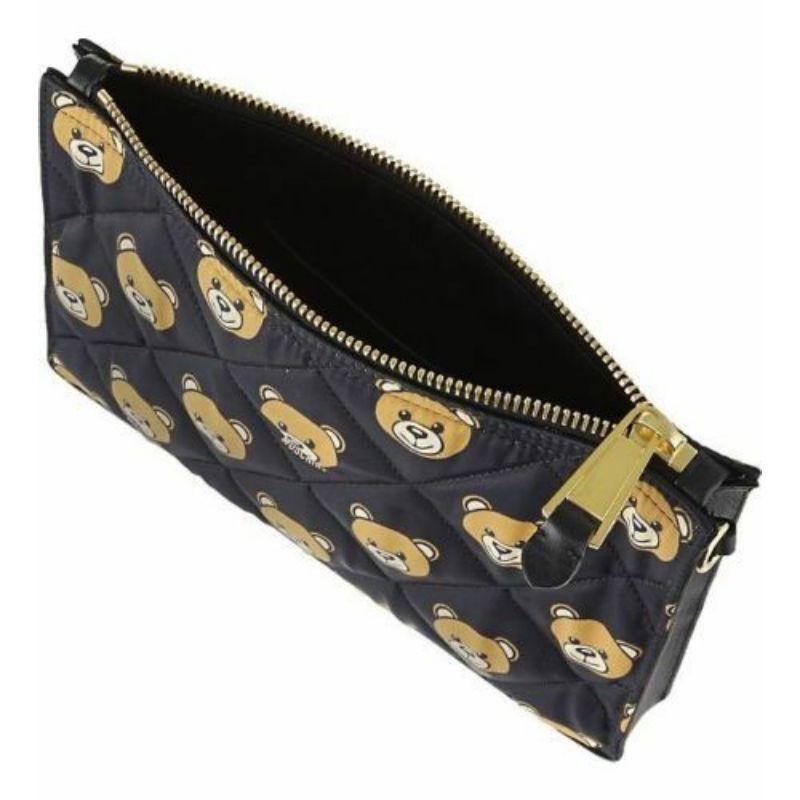 AW15 Moschino Couture Jeremy Scott Brown Black Quilted Clutch Bag Ready to Bear

Additional Information:
Material: Nylon with Leather trim  
Color: Black/Brown
Pattern: Ready to Bear, Bear Print
Style: Clutch
Dimension: 10 L x 1.5 D x 6.6 H