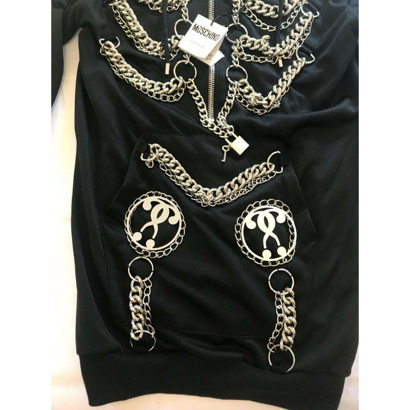 AW16 Moschino Couture Jeremy Scott Black Sweatshirt Hoodie Dress W/ Chains Hoops

Additional Information:
Material: 57% Polyester, 43% Cotton    
Color: Black / Silver    
Pattern: Chains and hoops    
Style: Hooded Dress
Size: US 4 / 38 IT
100%
