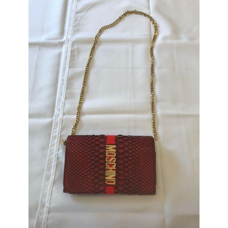 AW16 Moschino Couture Jeremy Scott Red Leather Wallet Shoulder Bag W/ Gold Logo

Additional Information:
Material: Leather
Color: Red/Gold
Style: Shopper Tote
Dimension: 7.5 W x 4 D x 5.5 H in
100% Authentic!!!
Condition: Brand new with Moschino