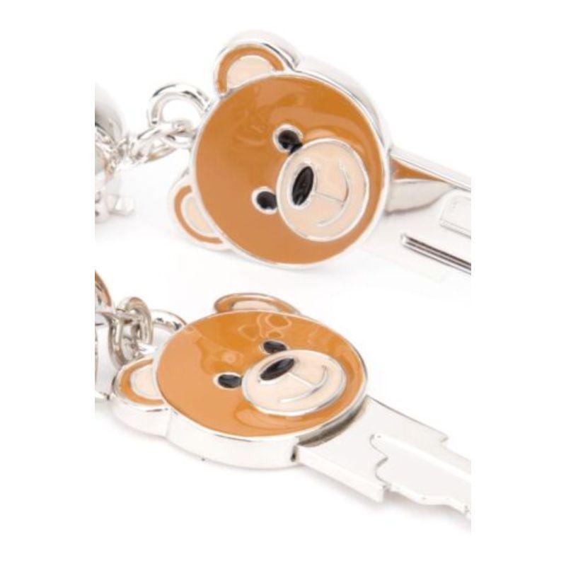 AW16 Moschino Couture x Jeremy Scott Key Teddy Bear Clip on Earrings 100% Metal

Additional Information:
Material: Metal
Color: Multi-Color	
Pattern: Key Teddy Bear
Style: Clip  
100% Authentic!!!
Condition: Brand new, Moschino dust bag