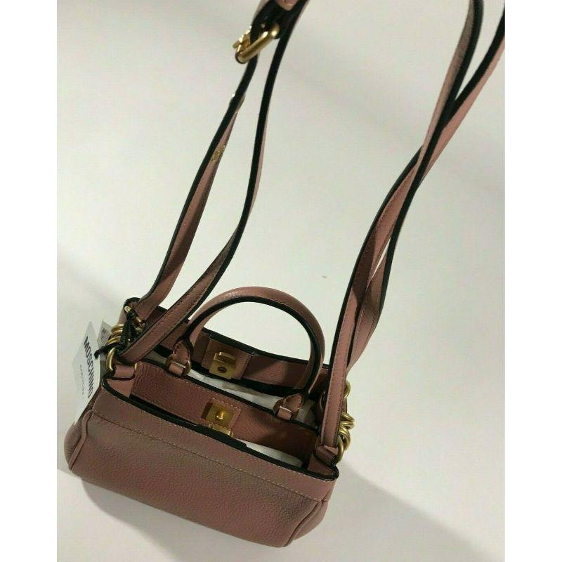 AW17 Moschino Couture Jeremy Scott Ancient Pink Leather B-pocket Handbag With gold Hardware

Additional Information:
Material: Leather 
Color: Ancient Pink    
Style: Handbag 
Dimension: 7.2 W x 5 D x 5.4 H in
100% Authentic!!!
Condition: Brand new