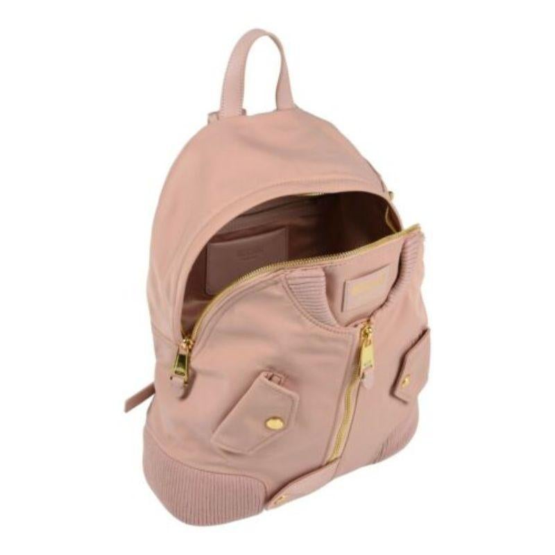 AW17 Moschino Couture Jeremy Scott Peach Bomber Jacket Backpack w/ Gold Hardware

Additional Information:
Material: 90% Nylon backpack with 10% leather
Color: Peach/Gold
Pattern: Peach
Style: Backpack
Dimension: 12.5 W x 5.5 D x 15.5 H in
100%