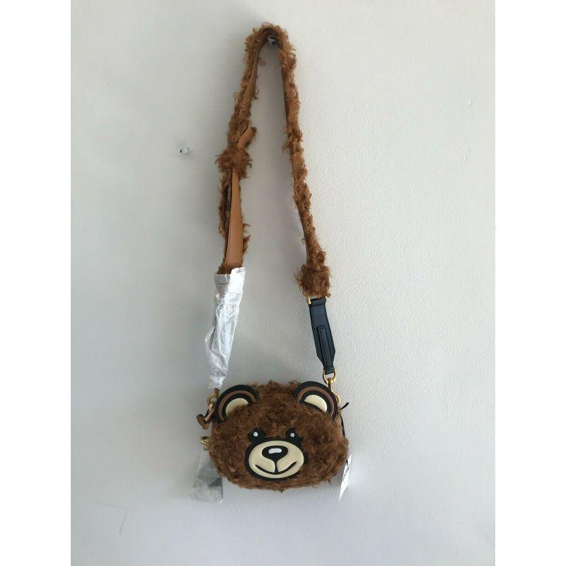 AW18 Moschino Couture Jeremy Scott Fur Teddy Bear Head Crossbody Shoulder Bag

Additional Information:
Material: Faux Fur and leather details, Gold-tone Metal
Color: Brown/Black
Pattern: Furry
Style: Shoulder Bag/Crossbody Bag
Dimension: 8 W x 2.25