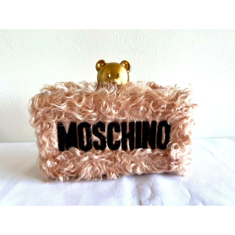 AW18 Moschino Couture Jeremy Scott Pink Faux Fur Teddy Bear Head Shoulder Bag

Additional Information:
Material: Faux Fur
Color: Pink
Pattern: Teddy Bear Head
Style: Shoulder Bag
Dimension: 7.5 L x 2.25 D x 4.1 H in
Accents: Fur Trim
Year