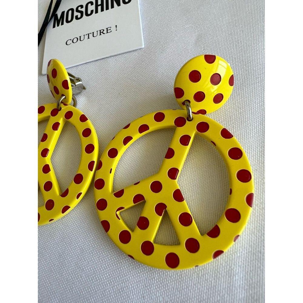 AW18 Moschino Couture Jeremy Scott Yellow Peace Sign earrings with Red PolkaDots

Additional Information:
Material: 100% PL
Color: Yellow, Red
Size: OS
Style: Dangle/Drop
Pattern: Polka Dot, Peace Sign
Dimensions: 1.875 mm Diameter
Condition: Brand