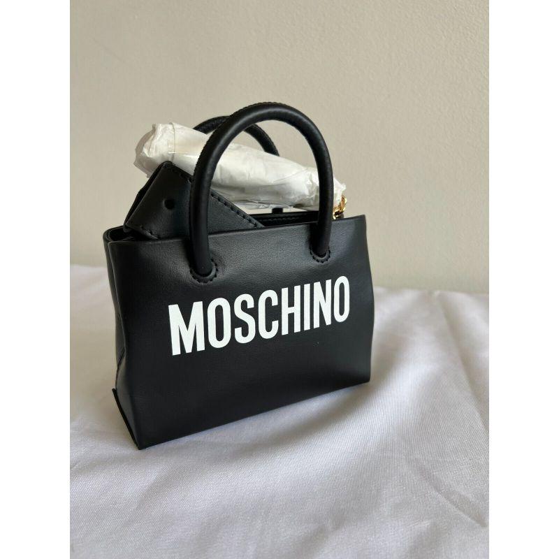 AW20 Moschino Couture Jeremy Scott Black Leather Mini Shopper / Fanny Pack

Additional Information:
Material: Leather
Color: Black, White, Gold
Size: Mini
Style: Belt Bag / Shoulder Bag / Shopper
Dimensions: 6