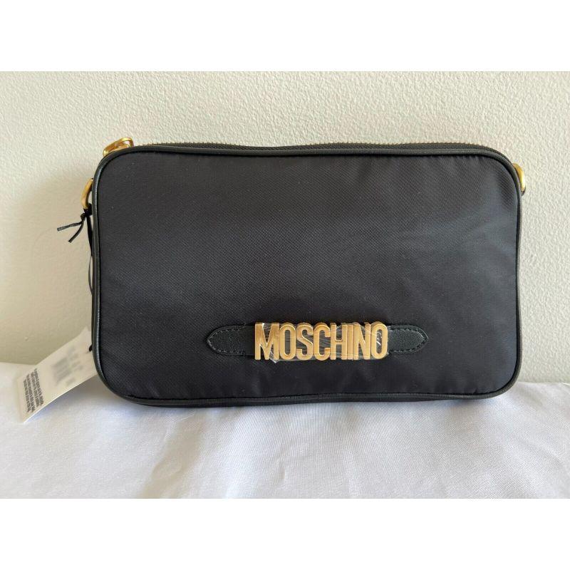 AW20 Moschino Couture Jeremy Scott Black Nylon Shoulder Bag With Gold Logo

Additional Information:
Material: Nylon with Leather details
Color: Black, Gold
Size: Medium
Style: Shoulder Bag
Dimensions: 10