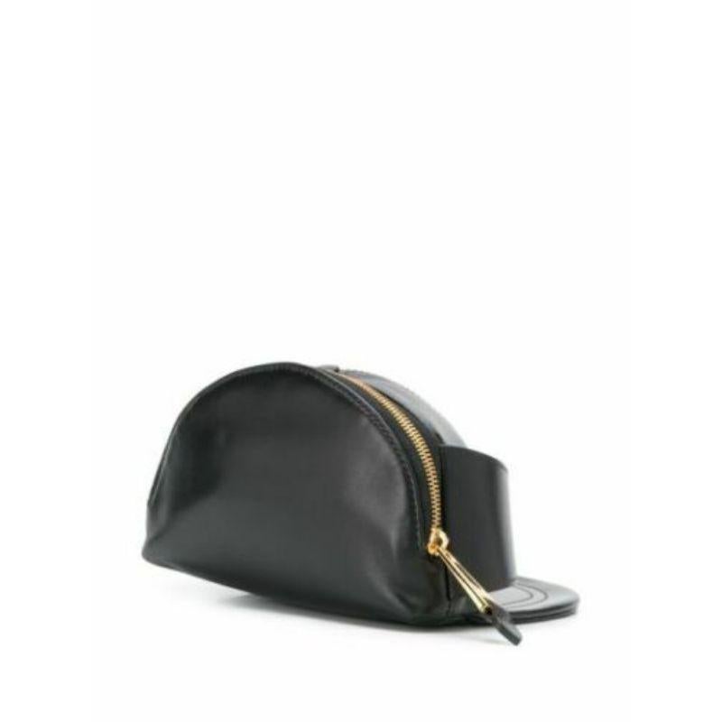 AW20 Moschino Couture Jeremy Scott Black Leather Hat Shaped Fanny Pack Gold Logo

Additional Information:
Material: Leather, Gold Metal
Color: Black/Gold
Style: Belt Bag        
Dimension: 8 W x 7 D x 4.7 H in
Theme: Hat
Accents: Buckle, Logo
Year