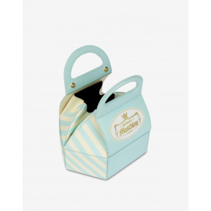 AW20 Moschino Couture Jeremy Scott Cake Box Leather Blue Bag Marie Antoinette

Additional Information:
Material: Leather, Gold-tone Metal
Color: Light Blue-Turquoise/Yellow Cream/Gold
Pattern: French Pastry
Style: Handle Bag        
Dimension: 7.75