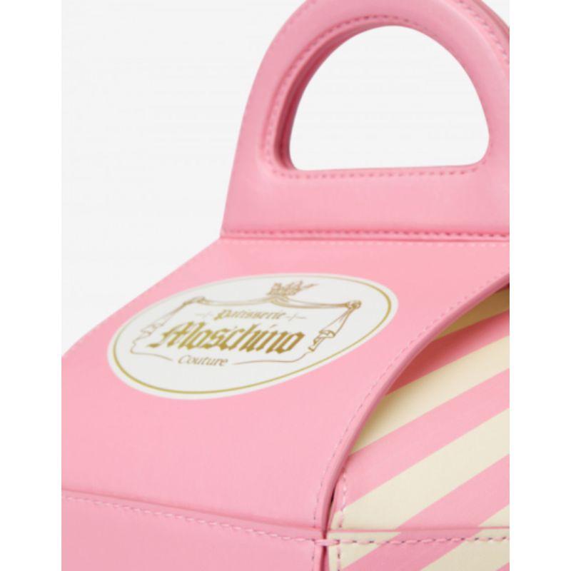 AW20 Moschino Couture Jeremy Scott Cake Box Leather Pink M Bag Marie Antoinette

Additional Information:
Material: 100% Calfskin Leather
Color: Pink/Yellow Cream/Gold
Pattern: French Pastry
Style: Handle Bag        
Accents: Logo
Dimension: 10.6 W x
