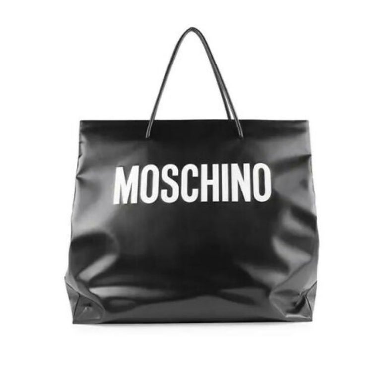 AW20 Moschino Couture Jeremy Scott Oversized Gigantic Black Shopper W/White Logo

Additional Information:
Material: Polyurethane/polyester/viscose, Black Silk
Color: Black/White
Pattern: Oversized
Style: Shopper
Dimension: 25.5 W x 11.5 D x 24.75 H