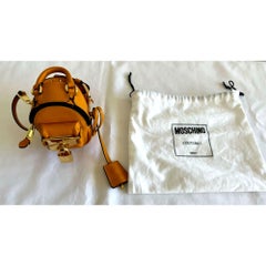 AW20 Moschino Couture Mustard Backpack Shaped Shoulder Bag by Jeremy Scott