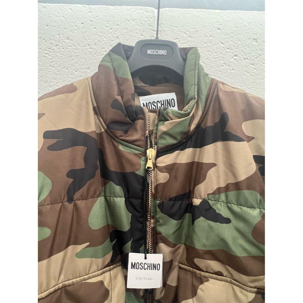 AW20 Moschino Couture Jeremy Scott Woodland Camouflage Coat Gold Embellishments

Additional Information:
Material:  - 100% Polyester
Color: Green, Black, Brown, Sand
Size: IT 50 / US 16
Pattern: Camouflage
Style: Puffer Jacket
Dimensions: Shoulder