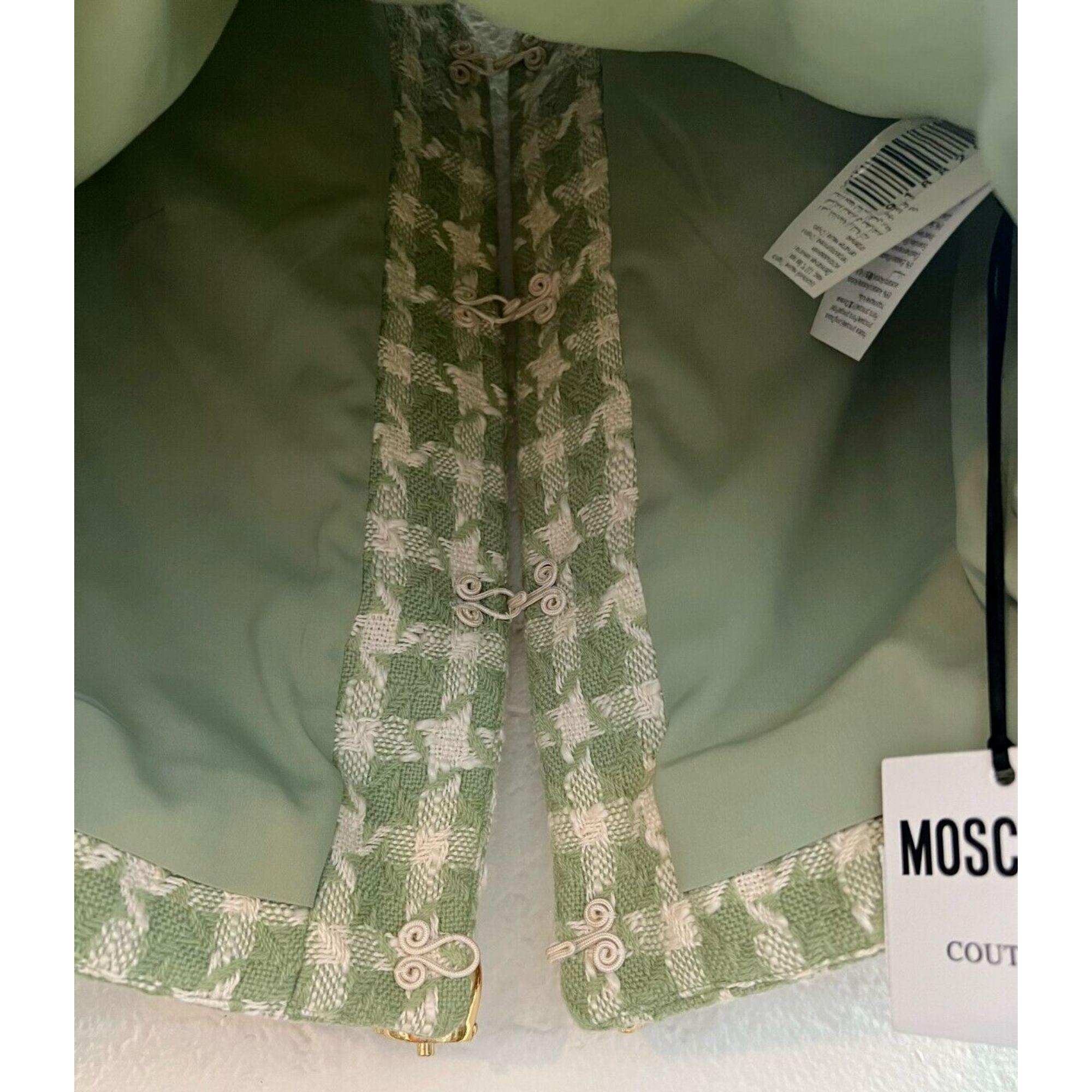 AW21 Moschino Couture Jeremy Scott Green White Wool Cotton Jacket with Cow Bells

Additional Information:
Material: 51% Wool, 49% Cotton
Color: Green, White
Size: IT 40 / US 6
Pattern: Check
Style: Blazer
Dimensions: Shoulder to shoulder 15.5