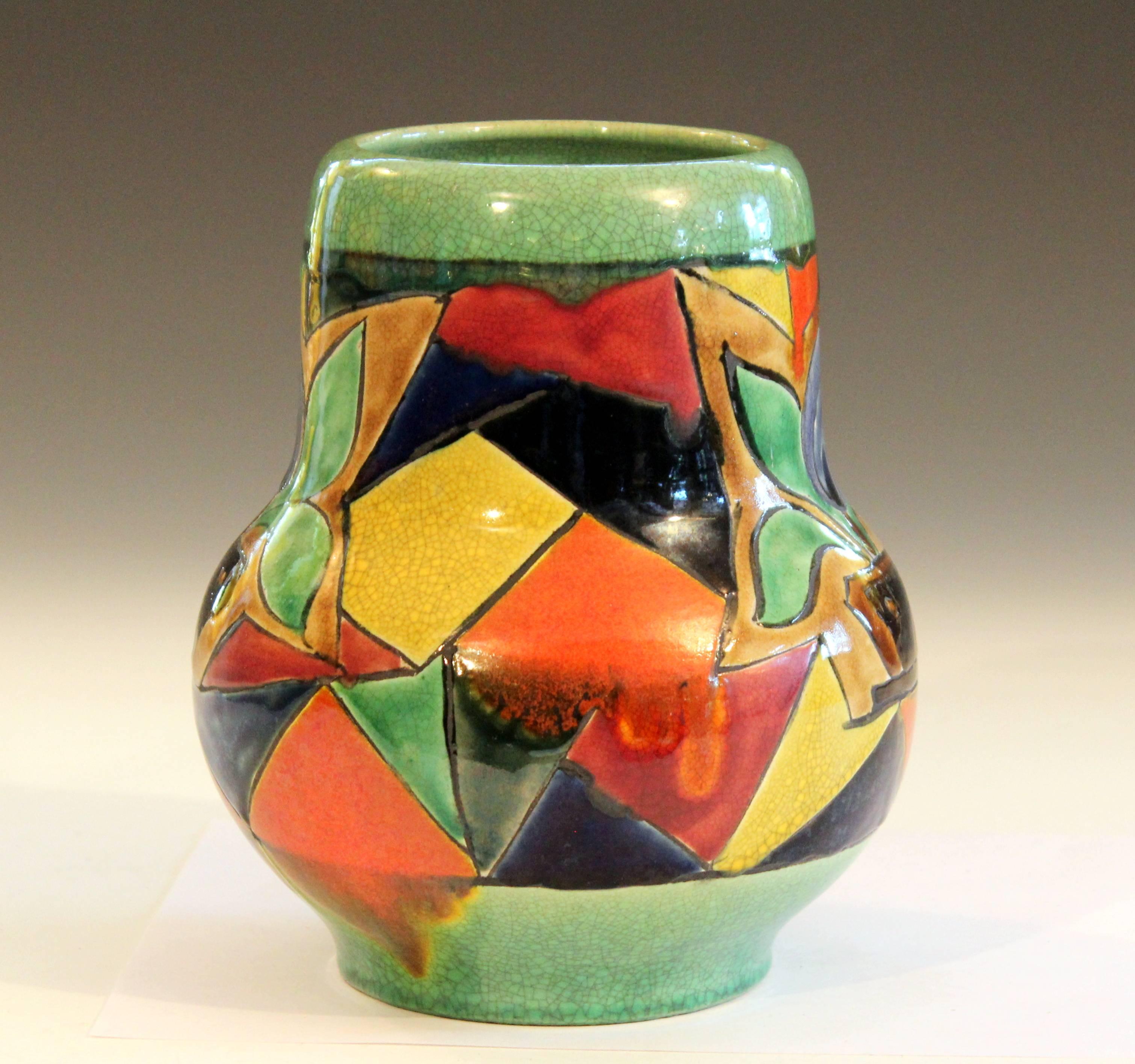 Vintage Awaji vase with interesting fragmented Art Deco design of a potted plant against a light green crackle glaze ground, circa 1930. Impressed marks. Measures: 8