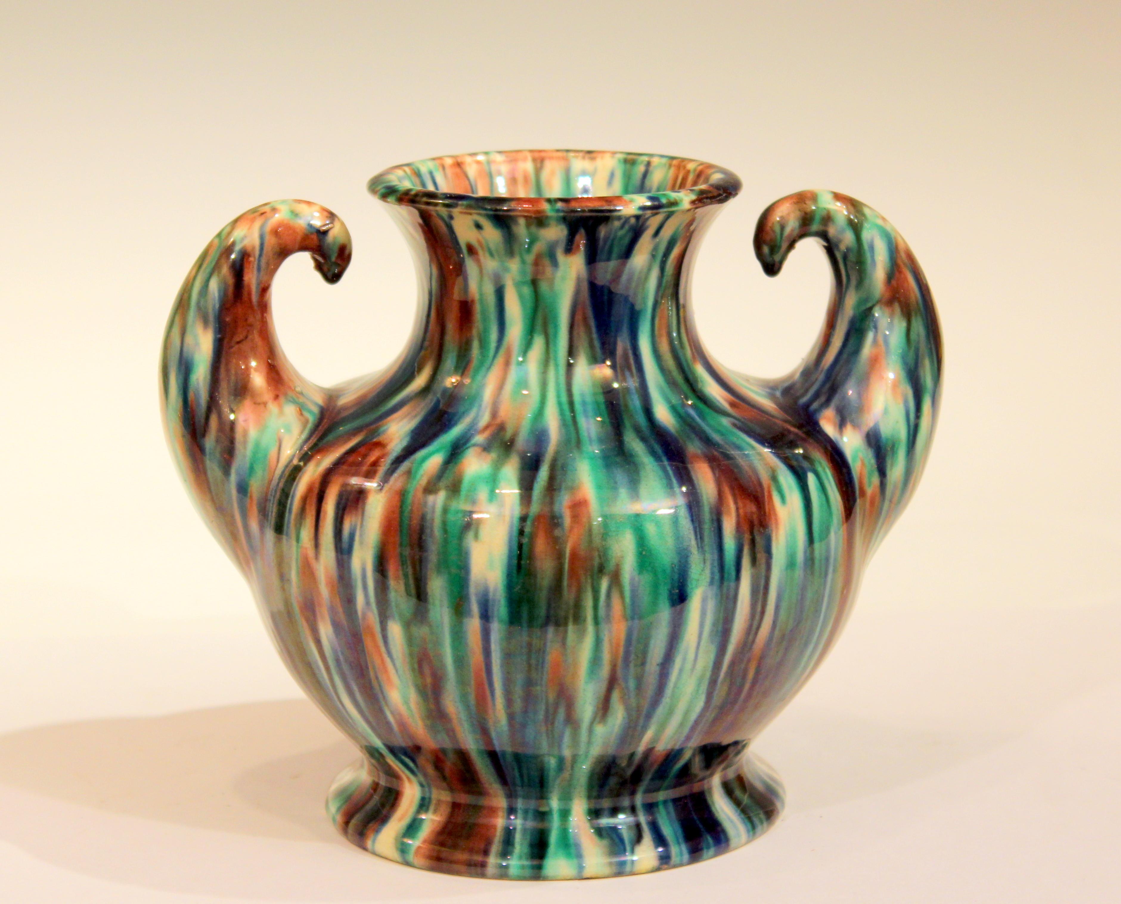 Awaji Pottery vase in Art Deco form with outstreched arms flexing and striking flambe glaze, circa 1930. Impressed marks. Measure: 6