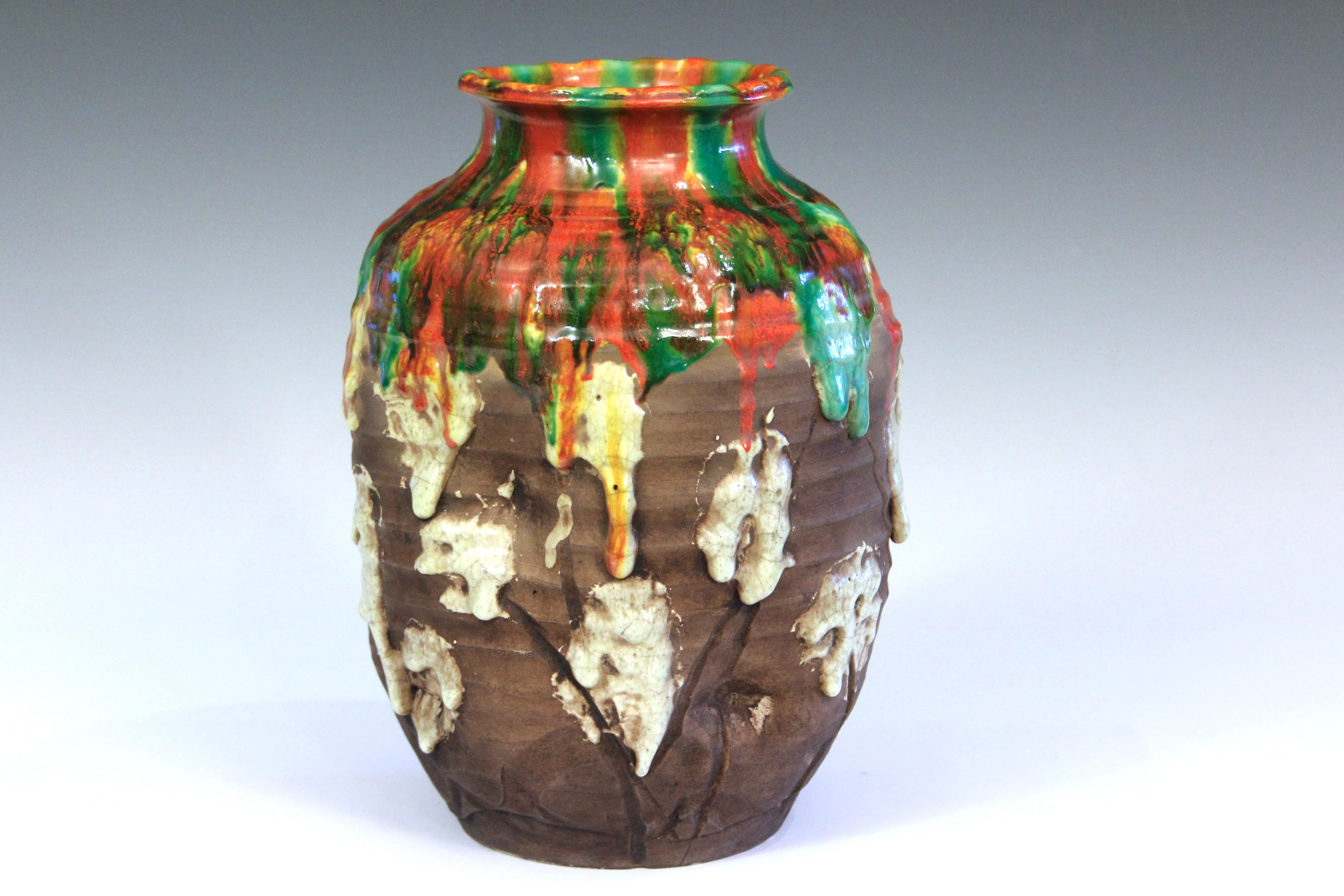 Vintage Awaji pottery vase or jar in gouged and manipulated form with foamy orange, green, and white drip glaze, circa 1930. 10 1/2