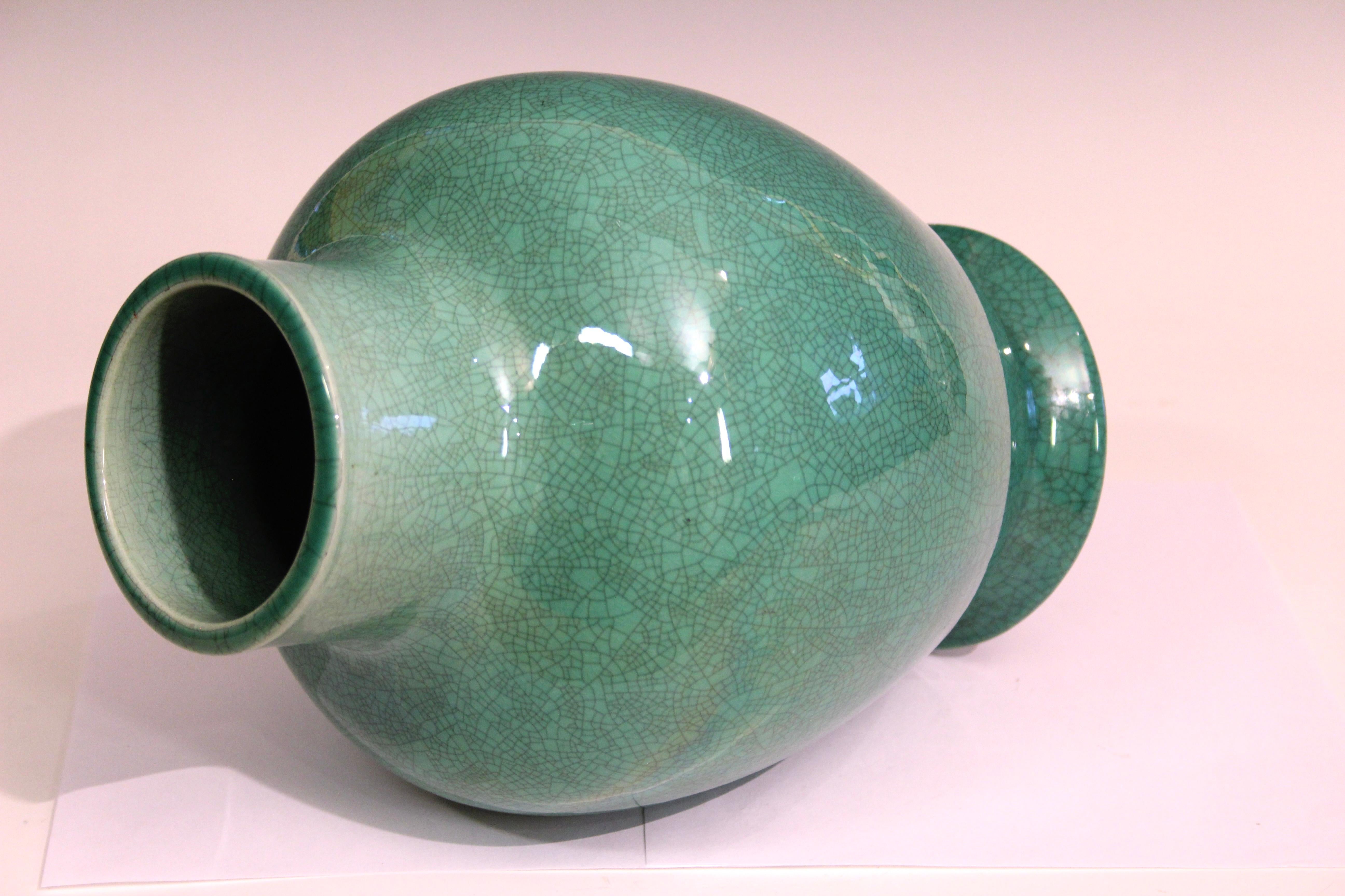 Large Awaji pottery vase in luminous green crackle glaze, circa 1930. This vase is in the Hu form, a shape with origins in ancient Chinese bronze vessels that was later embraced in Japanese pottery, including Awaji ware. The form is somewhat