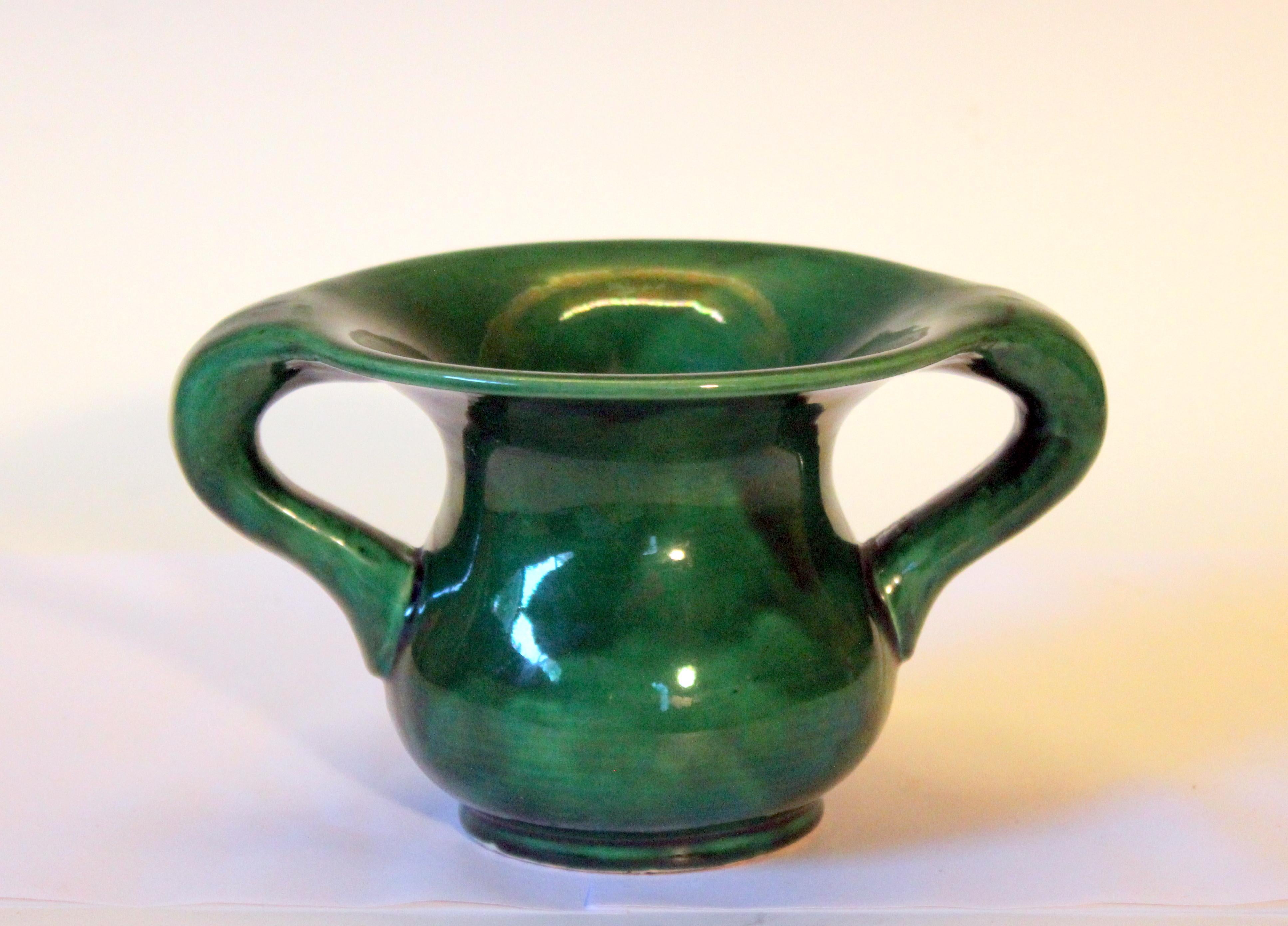 Awaji Pottery vase in flowing Art Nouveau form with curving handles and blooming mouthrim in magical green monochrome glaze, circa 1910s. Export label on base. Measures: 5
